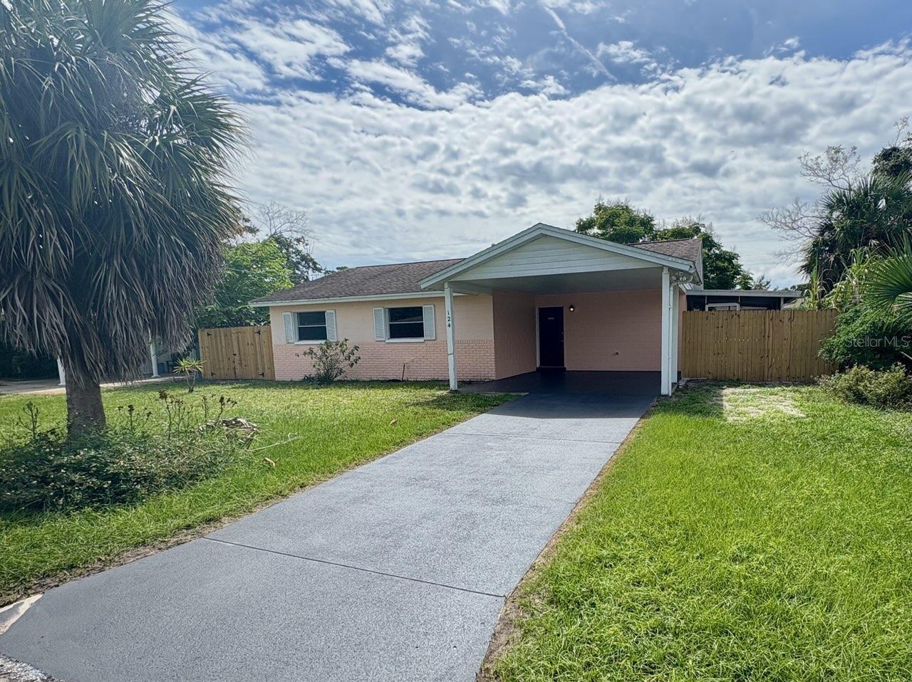This lovely block three-bedroom one bath home is just a short walk down the block to the intercoastal waterway. There are several public parks along the river that provide access to all the intercoastal has to offer, a sand beach, boat launches, picnic area, or just sit and watch the boats cruise as dolphins frolic near the shoreline. The home has new high end luxury waterproof vinyl plank flooring in all the bedrooms, installed in September of 2025, a new A/C and a solid roof that is 13 years young. The property has natural gas for the water heater, and electric service for the rest of the home. There is a screened-in enclosed porch on the west side of the house, and an open-air covered porch on the back of the house. The yard is fenced, with some newer fence and gates added in September of 2025. This would be a great starter home for a young couple that longs to the close to the water or a place for a couple to retire.