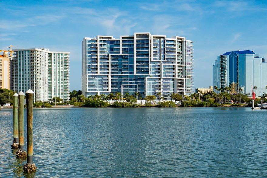 Panoramic views of Sarasota Bay shimmering through 10’ floor-to-ceiling windows greet you as you enter this sophisticated, light-filled condominium in one of the most distinctive buildings and desirable locations in downtown Sarasota. Step out of your private elevator and foyer into a personal sanctuary of luxury, privacy and convenience. Surrounding you in close proximity are all the exciting venues of Sarasota, with its rich cultural life of theatre, music and art, vibrant dining and shopping, and miles of white sugar-sand beaches. 
The spacious open floor plan provides welcoming flow for entertaining, as guests mingle and enjoy breathtaking views of the Bay, Marina and Gulf of Mexico beyond. The large great room is the heart of the home and adjoins seamlessly with a gracious dining area and striking black-and-white kitchen with high-end appliance and walk-in pantry. Two en suite bedrooms, a versatile den/office and an additional elegant full bath provide comfortable indoor living space. An airy balcony off the primary bedroom and great room invites you to take in the view over coffee in the morning or an evening cocktail.
The sophisticated, beautifully appointed interior features gleaming tile floors in the main areas, luxury vinyl in bedrooms and extensive custom cabinetry throughout.  Three large custom-designed closets, including an enormous walk-in off the primary bedroom, provide abundant storage for your wardrobe and more. A separate laundry room is located right off the private foyer. Additional climate-controlled storage in the lower level garage.
The iconic Vue Sarasota Bay sets a high bar for downtown living in Sarasota. It provides a full-service luxury lifestyle that combines security and privacy with a strong sense of community. A full schedule of events offers homeowners opportunities to socialize as much, or as little, as they choose. Full-time concierge service, valet parking, and on-site management are among the myriad amenities enjoyed in the building. Two dedicated parking spaces in garage make transportation easy. If you enter through the elegant main lobby, you are welcomed by cordial staff and approximately 7,000 square feet of interior common space, including a formal owner’s lounge with fireplace, bar and catering kitchen—all overlooking a resort-style pool with outdoor grills and sundeck perched above Sarasota Bay. A fully-equipped fitness center and rooftop dog park meet the exercise needs of owners and their furry friends.
Expecting guests? The luxury Westin Hotel is right next door, offering four-star accommodations and dining, plus a rooftop pool and bar with spectacular views. 
You will be wowed the moment you walk into #509 at The Vue--and entering a lifestyle of your dreams if you stay!
