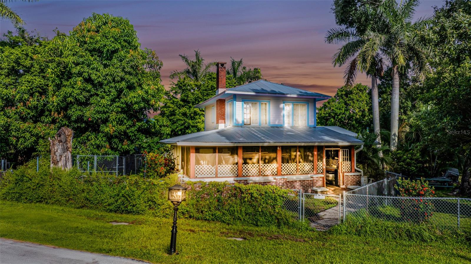 Historic 1925 Charmer with Room to Grow! Lovingly known as the "Conch Shell House" on the historic register!
Step into the timeless appeal of this two-story 1925 home, brimming with character and potential. Offering over 1,400 sq. ft. of living space, this 2-bedroom, 2-bath residence features a flexible layout with spacious bedrooms located on both levels—ideal for multi-generational living or hosting guests. The upstairs suite also features a laundry/utility room to compliment the downstairs laundry/mudroom!
The home boasts an updated kitchen, a newer metal roof, and a completely fenced yard, providing both peace of mind and privacy. Set on a generous 0.58-acre lot just blocks from the Caloosahatchee River, this property offers ample space for future expansion, a pool, garden, or garage—let your imagination take root!
Whether you’re looking for your first project to call home... a historic restoration project, or an investment with great bones, this gem offers the perfect canvas. With a few finishing touches, this classic beauty will shine for generations to come!