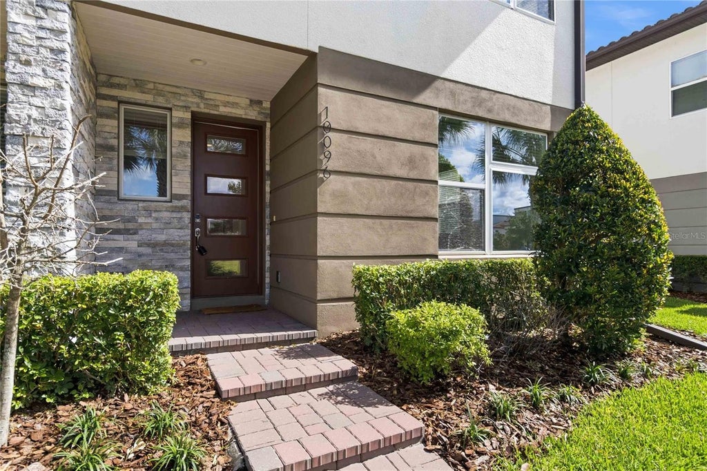 Photo of 10096 Sunnifa Alley, Orlando, FL 32832 (MLS # O6428721)