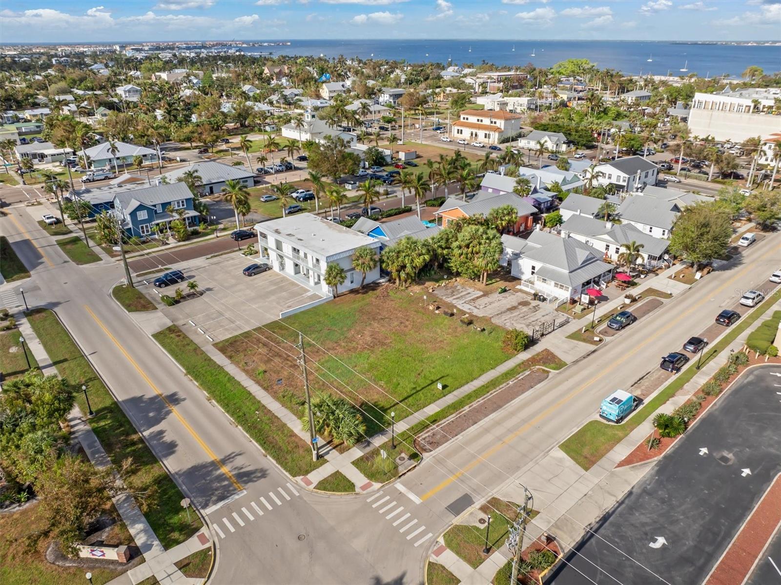 Prime commercial/mixed-use corner in the heart of downtown Punta Gorda. With high visibility at a busy intersection and a 2024 traffic count of 6,900 vehicles per day on Taylor Street, this site offers unmatched exposure and accessibility. Surrounded by local favorites including restaurants, coffee shop, wine bar, attorney, bookstore, banks, and the DMV, this property sits at the center of daily downtown activity. Flexible zoning allows for retail, office, or residential use—meeting the growing demand for more downtown spaces. This parcel is ready for a new vision to take shape. Build-to-suit opportunities available.