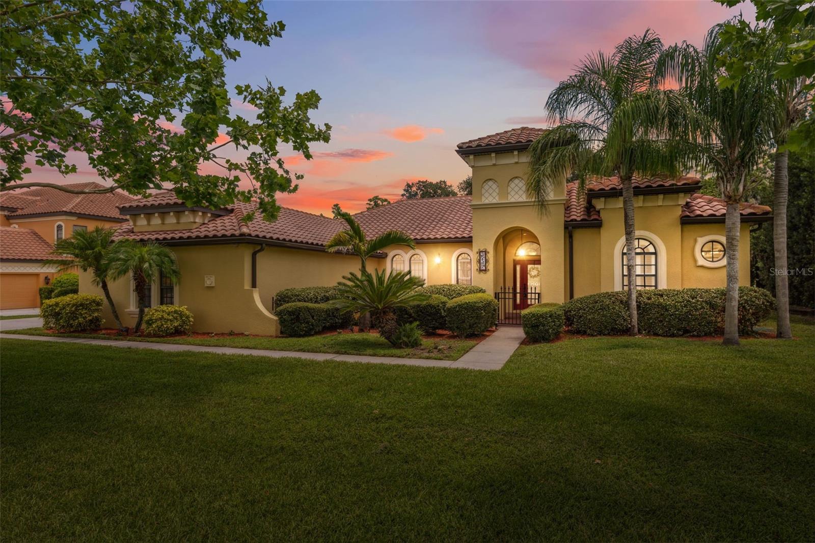 Perfectly positioned on a scenic spring-fed lake in the highly sought-after gated community of Toulon, this immaculate 4-bedroom, 3-bath pool home offers the perfect blend of space, privacy, and natural beauty. Enjoy peaceful mornings overlooking mature cypress trees and abundant wildlife from your fenced backyard or the inviting front courtyard—ideal for coffee or quiet reflection. This move-in ready estate features brand-new carpet, fresh interior paint, and thoughtful upgrades throughout, including a media room, whole-house vacuum system, generator, built-in office desk, and a spacious 3-car garage. The home is also pre-plumbed for an outdoor kitchen, making it easy to create your dream backyard oasis. With serene lake views as your everyday backdrop, you can even enjoy battery-operated boating right from your backyard—perfect for relaxing afternoons on the water. The open floor plan is ideal for both everyday living and entertaining. Toulon is known for its quiet beauty, large homesites, and privacy—with no CDD fees and no flood insurance required. Opportunities like this are rare—where all the work has been done and all that’s left is to enjoy the Florida lifestyle at its finest.