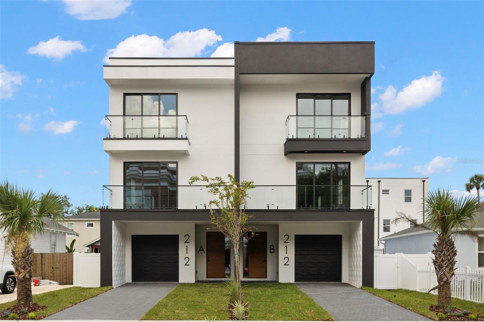 New Construction Townhome in Tampa Heights. Discover this stunning 4-bedroom, 4.5-bathroom new construction townhome, perfectly designed for modern living and simultaneous investment potential. On the first floor you will find the one car garage & a fully equipped private studio with its own entrance, kitchen, and full bathroom—ideal for short or long-term rentals, in-law suites, or guest accommodations. On the second level you will find your main living quarters. Here, you'll find a stylish moody kitchen, half bath, glass wall, laundry, balcony, & open concept living with plenty of space for entertainment. On the third level you will find 2 well appointed guest rooms, each with their own en-suite baths. The expansive primary bedroom is also located on the third level & features a moody en-suite bathroom, built out closet, & private balcony. Located just steps from Armature Works, Tampa Riverwalk, and all the dining, shopping, and all entertainment in Downtown Tampa, this home offers unmatched convenience in one of the city’s most sought-after neighborhoods.