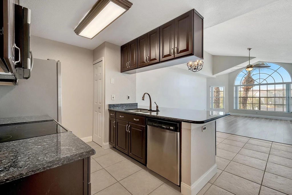 Photo of 2452 Sweetwater Club Circle #28, Kissimmee, FL 34746 (MLS # O6451091)