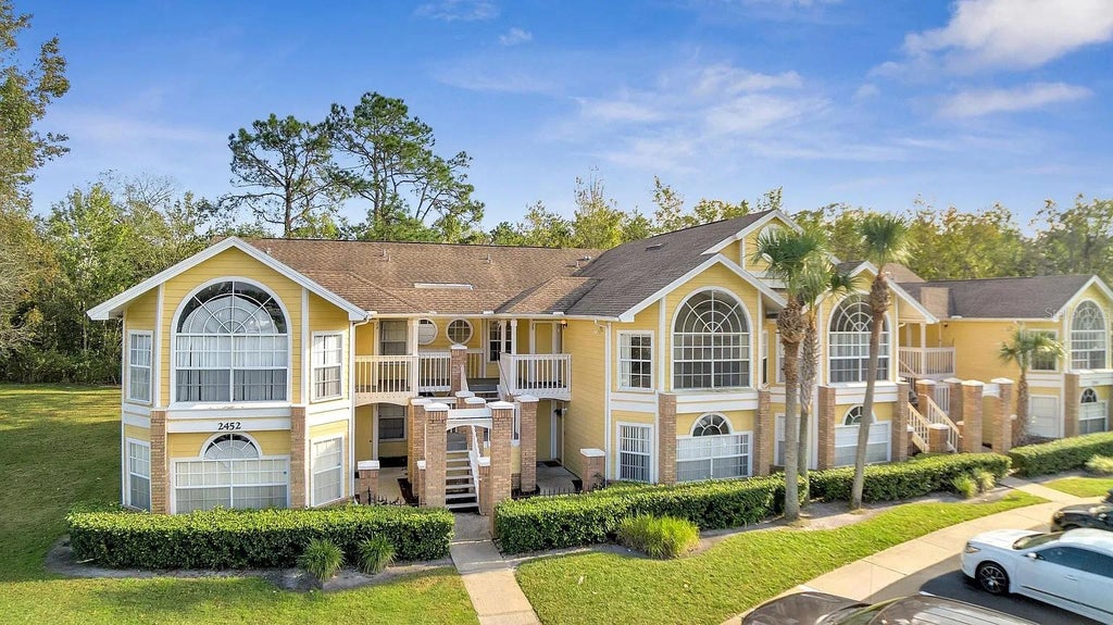 Photo of 2452 Sweetwater Club Circle #28, Kissimmee, FL 34746 (MLS # O6451091)