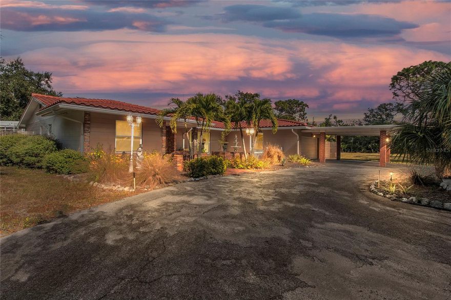 One or more photo(s) has been virtually staged. Retro Sarasota estate in Desoto Acres on 2.18 acres. This 5BR/5BA home features original retro terrazzo flooring, classic mid-century styling, and a separate but connected 2 bedroom with bath in-law suite ideal for multi-generational living or guests. Large windows provide natural light and views of the property’s bird-sanctuary setting. Enjoy an in-ground swimming pool, expansive outdoor space, and the privacy Desoto Acres is known for. Conveniently located near award-winning Siesta Key Beach and the UTC Mall. A rare opportunity to own a spacious property in one of Sarasota’s legacy neighborhoods Enter through your own private electric gate, enjoy the peace and serenity.