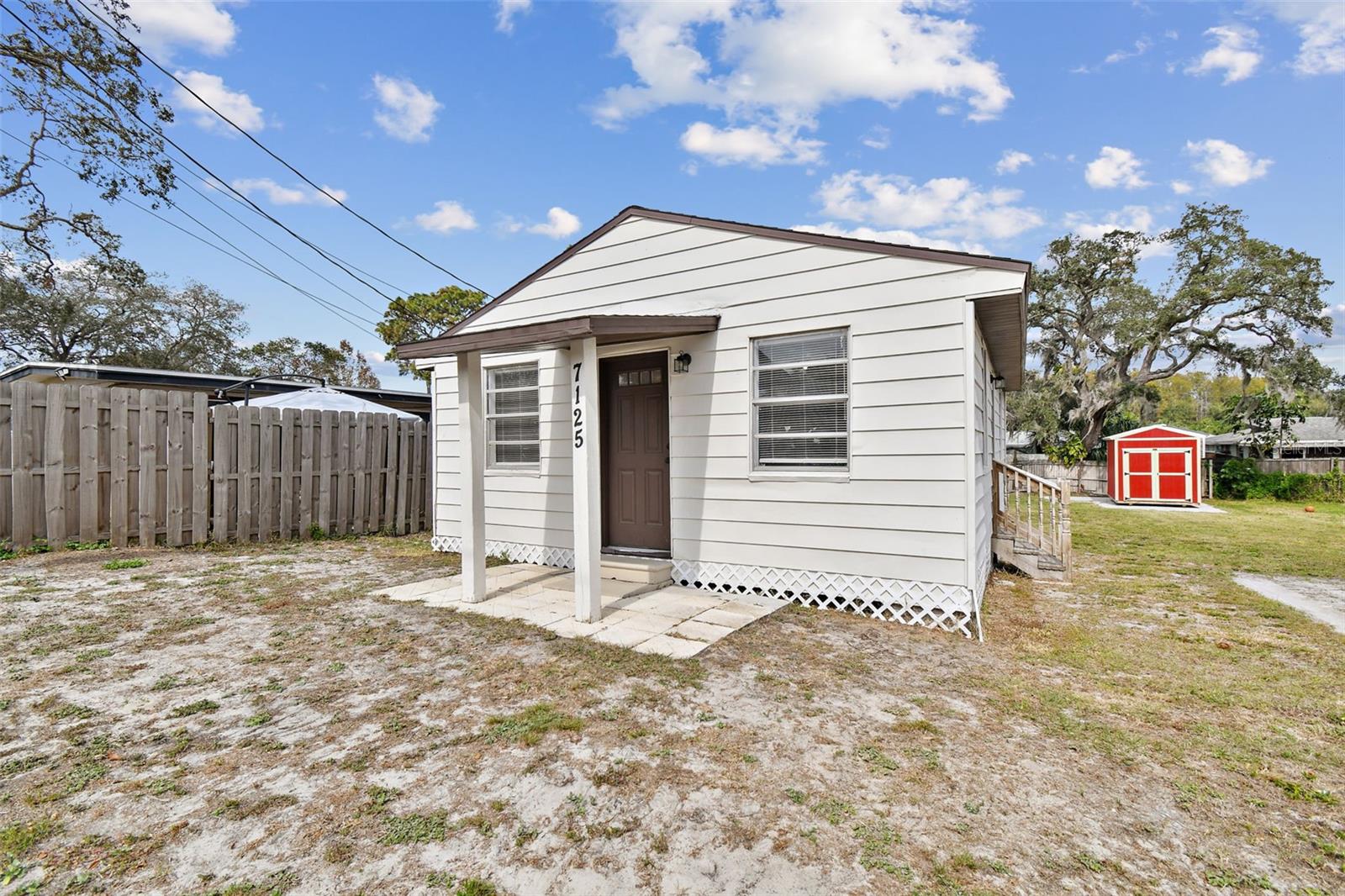 Charming 1-bedroom, 1-bath home in the heart of Port Richey, perfect for first-time buyers, downsizers, or investors! This 600 sq. ft. retreat features a bright living area, functional kitchen, and bedroom with ample storage. Recent updates include Roof (2022), HVAC (2022), Septic Tank (2022), Storage Shed (2024), and New Electrical Panel (2024). Enjoy a spacious backyard ideal for entertaining or gardening, plus a utility shed for extra storage. Conveniently located near parks, shopping, dining, and Gulf Coast beaches. Schedule your showing today!