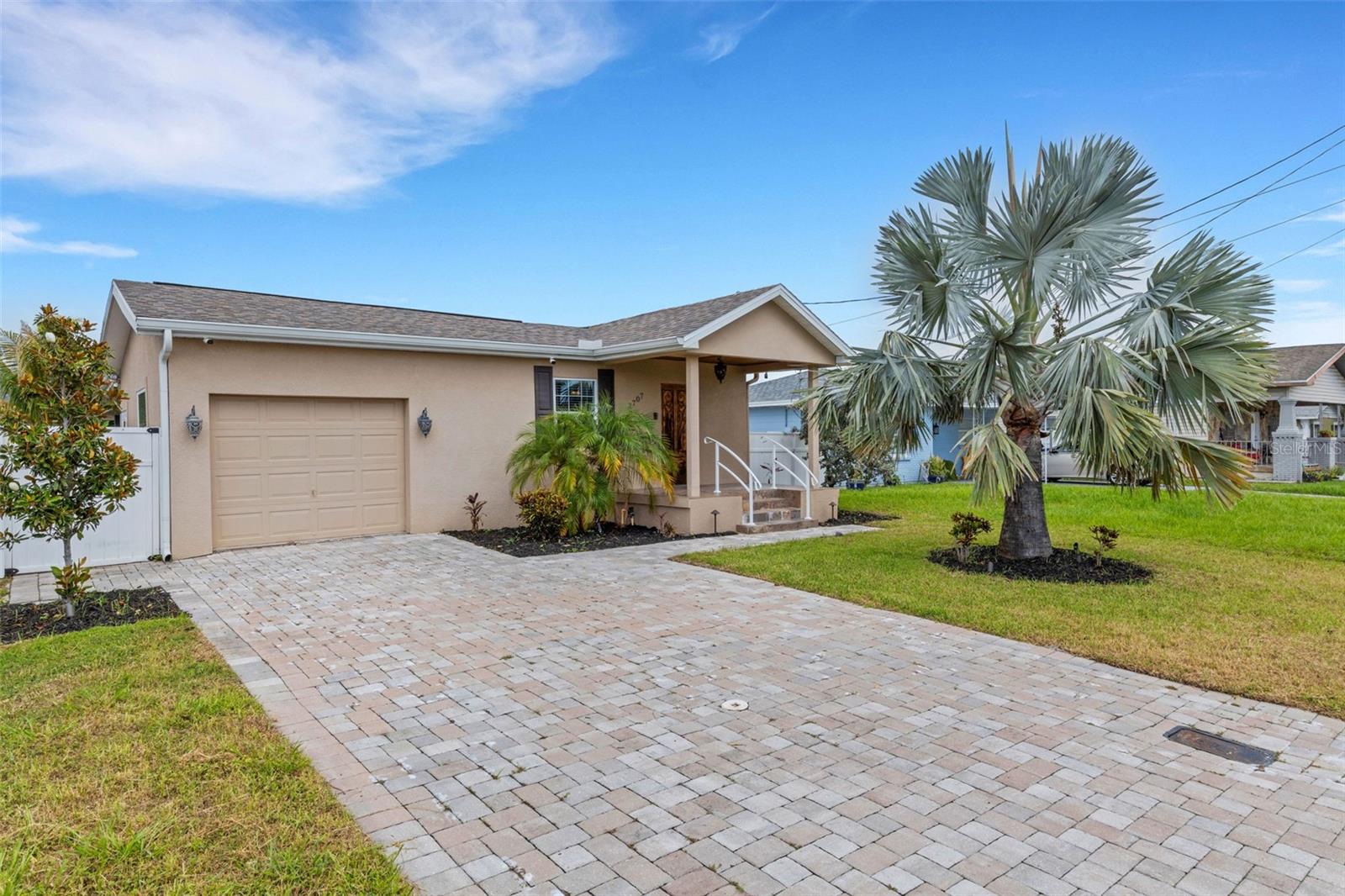 One or more photo(s) has been virtually staged. Welcome to 2707 W Leroy Street — a mid-century Mediterranean gem nestled in the heart of West Tampa. Originally built in the 1950s and thoughtfully updated throughout, this 4 bedroom, 4.5 bathroom, in-law suite property with newly paved and screened in lanai (2020), newer roof (Main home - 4 y.o. / In-law - 12 y.o.) and outdoor kitchen offers a blend of character, functionality, and versatile living spaces that make it truly one of a kind.
As you pull into the paved driveway, you’ll immediately notice the mature landscaping that frames the home beautifully, creating a warm and inviting curb appeal. Step inside and you’re greeted by an open and airy living and dining space with tile flooring that carries throughout the entire home — including the garage. The kitchen is both stylish and practical, featuring rich walnut-stained shaker cabinetry, granite countertops, stainless steel appliances, pendant lighting, and a breakfast bar with seating for four.
The main home includes three spacious bedrooms and three full bathrooms. The primary suite is a peaceful retreat with a large walk-in closet and a luxurious en-suite bath complete with a travertine-tiled walk-in shower and a jetted soaking tub. One guest bedroom includes its own en-suite bathroom, while the third bedroom has easy access to another full bath.
Just off the main living area is a dedicated office space with built-in cabinetry — perfect for working from home or managing day-to-day tasks. A door from the office leads you outside to the oversized screened lanai, where outdoor living takes center stage. This incredible entertaining space features an outdoor kitchen, complete with a refrigerator, kegerator, ample bar seating, and a convenient half bathroom for guests. Two additional large walk in storage rooms anchor the screened-in lanai.
Beyond the lanai, you’ll find a detached guest suite with its own private entrance, full bathroom, walk-in closet and separate A/C system — ideal for visitors, in-laws, or even a creative studio or workspace. The entire property is fully fenced, offering plenty of space and privacy.
Additional upgrades include 2015 HVAC, 2018 water heater, Ring security system with doorbell and cameras, smart irrigation, WiFi-enabled thermostats, smart lighting, a split HVAC system for the guest suite, and pre-wiring for a 240V electric vehicle charger.
Whether you’re looking for a home with room to host, space to work, or the potential for multigenerational living, 2707 W Leroy Street offers a rare opportunity to enjoy it all in a beautifully updated and move-in ready home. Located just minutes from Midtown Tampa and the Raymond James Stadium, you’ll find yourself in the center of it all. Enjoy easy access to Armature Works, Riverwalk, Downtown Tampa, and Hyde Park Village — where you'll find some of the city’s best dining, shopping, and nightlife. Catch a Bucs game, explore local breweries, or spend a weekend at nearby Julian B. Lane Riverfront Park. With quick access to I-275, Tampa International Airport is just a short drive away, making travel and commuting a breeze.
Don’t miss your chance to experience this one-of-a-kind West Tampa home — where timeless charm meets modern convenience.