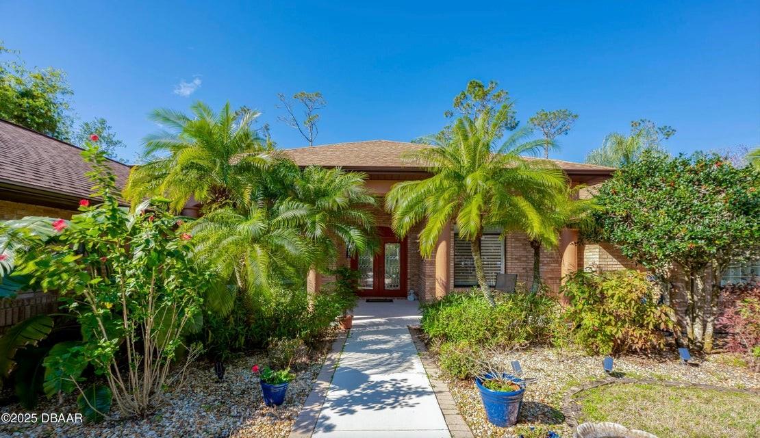 Imagine waking up to the sparkling allure of your own private pool in this stunning Ormond Beach home within the highly sought-after, gated community of Breakaway Trails! Sunlight dances on the water, inviting you to step outside through disappearing multi-slide pocket doors, seamlessly blending the spacious interior with your tranquil outdoor retreat. This exceptional pool-centric property is designed for effortless Florida living and entertaining. Picture sunset cocktail hours on your expansive patio and weekend barbecues with direct poolside access from every wing of the home. Inside, experience the elegance of 10-foot ceilings and a thoughtfully designed split floorplan offering both privacy and exceptional flow. The heart of this home extends outdoors to a 40-foot lap pool complemented by a soothing jacuzzi, creating your personal oasis for relaxation and rejuvenation.
More to Love:
Luxurious Primary Suite Retreat: Escape to your sprawling haven on the North side, featuring a relaxing sitting area, direct pool access via plantation shutter sliders, and a lavish en suite bathroom with dual vanities, a garden tub, a separate glass shower, and two generous walk-in closets for unparalleled comfort and convenience.
Expansive Ranch-Style Floor Plan: Enjoy abundant natural light and a comfortable, open layout perfect for family living.
Extra-Large Two-Car Garage with Workshop: Ideal for hobbyists, DIY projects, or simply extra storage space.
Plumbed for Additional Pool Bath: Offering potential for future expansion and convenience.
Ample Storage Throughout: Keep your home organized and clutter-free.
Charming Brick Exterior: Blends timeless appeal with lasting durability.
Peaceful and Private Front Porch: Enjoy morning coffee or evening breezes in your own outdoor sanctuary.
Breakaway Trails Offers an Unbeatable Lifestyle:
Active Amenities: Enjoy a basketball court, tennis courts, and pickleball courts for active outdoor fun.
Community Gathering Spaces: Benefit from a clubhouse and covered pavilion perfect for social events and gatherings.
Serene and Secure Environment: Nestled within serene, tree-lined streets in a highly sought-after established community featuring custom-built homes and 24-hour security-manned gated entrances.
Perfectly Located for Coastal Convenience:
Close to the Beach: Just 8 miles to the pristine shores of Ormond Beach for endless days of sun and sand.
Conveniently Situated: Enjoy easy access to top-rated schools, diverse shopping, and delicious dining options.
Embrace the Outdoors: Explore nearby parks, challenging golf courses, and beautiful nature preserves.
Your Private Oasis in a Premier Gated Community Awaits! This exceptional Ormond Beach property in Breakaway Trails is designed for those seeking luxury living, outdoor enjoyment, and a peaceful, secure lifestyle in a prime location. Don't miss the opportunity to own your slice of Florida paradise with a private pool, spacious living areas, and access to fantastic community amenities. Schedule your showing today!
