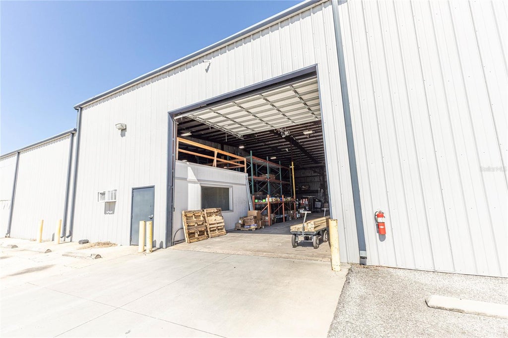 Photo of 719 Industrial Drive, Wildwood, FL 34785 (MLS # G5118977)