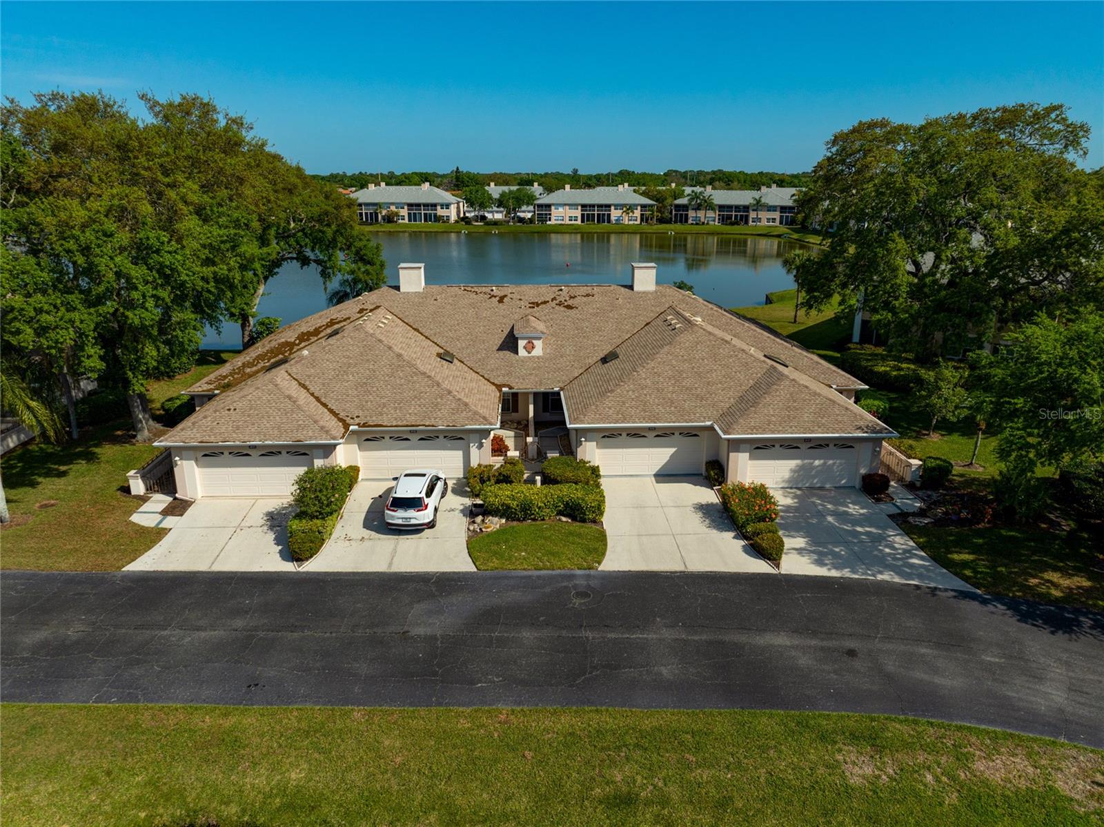 TREMENDOUS PRICE REDUCTION! Don’t miss this incredible opportunity to own a beautiful villa in one of Bradenton’s most desirable golf course communities! Located in Peridia Golf & Country Club, this charming home offers the perfect blend of luxury, leisure, and Florida lifestyle. Tucked on a private cul-de-sac and overlooking a peaceful pond, this villa provides a tranquil retreat with stunning water views and an inviting atmosphere. Step through the wrought-iron gated entry into a delightful courtyard and discover a home that truly feels like a sanctuary. Inside, the Master Suite features a private ensuite bathroom, a large walk-in closet, a second wardrobe closet, abundant natural light, and serene views of the pond. The second bedroom offers flexibility, ideal for guests or a home office setup. The kitchen boasts vaulted ceilings, a spacious dinette area, and direct access to the front courtyard, the perfect opportunity for you to design your own tropical garden escape. Just off the living room, the private enclosed lanai lets you soak in Florida's natural beauty. Relax and unwind as you watch native Florida birds gather and dive into the pond creating a tranquil oasis for relaxation and enjoyment…an ideal haven for morning coffee or evening cocktails. Residents of Peridia enjoy resort-style amenities, including: a Championship Golf Course Membership, Tennis & Pickleball Courts, Two Sparkling Pools, a Very Social Tiki Cabana Bar & Clubhouse, an On-Site Restaurant and Full Bar serving delicious food and cocktails, a well-stocked Pro Shop and Snack Bar...and so much more! With easy access to SR-70 and I-75, you're just minutes from shopping, dining, entertainment, and the gorgeous beaches of Sarasota, St. Petersburg, and Tampa. Act now, this lovely villa won’t last long at this reduced price! Schedule your private tour today and experience the best of Florida golf resort living!