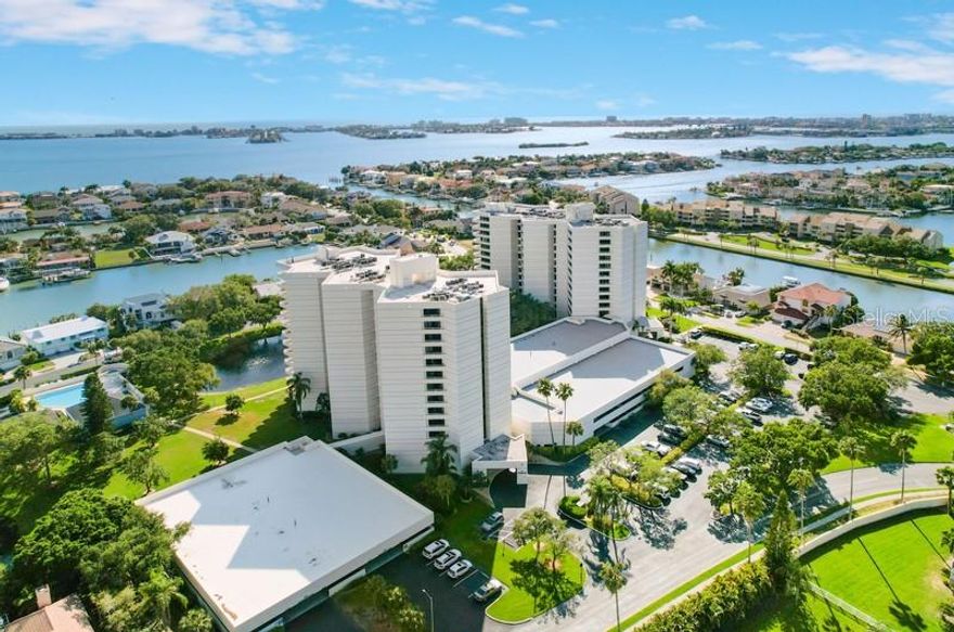BREATHTAKING WATER VIEWS from this elegant 11th-floor corner-end unit in the exclusive, guard-gated Pasadena Yacht & Country Club! Enjoy ultimate privacy and panoramic vistas of Boca Ciega Bay. This stunning waterfront condo offers the perfect blend of luxury, privacy, and coastal living.
Step inside to an open and inviting floor plan, perfect for entertaining. The spacious living room features a stunning contemporary TV wall with ledger stone and wood accents, and a bar-height wood butcher block countertop. Floor-to-ceiling windows flood the space with natural light and frame the spectacular water views.
The gourmet kitchen is standout, offering solid wood cabinetry, granite countertops, brand-new stainless-steel Samsung appliances, and a beautiful stone backsplash. Enjoy your morning coffee in the cozy breakfast nook or step onto the balcony to take in the view of luxury waterfront estates and the tranquil bay.
The primary suite is a true retreat, offering his-and-hers walk-in closets and an absolutely beautifully remodeled spa-like en-suite bathroom, featuring a custom vanity with quartz countertops and sleek glass faucets.
The second bedroom also includes a walk-in closet, private balcony access, and an adjacent beautifully remodeled bathroom, ideal for guests, family, or a stylish home office.  
Additional Features Include:
• Tile flooring throughout
• Recently replaced water heater
• In-unit laundry room with ample storage
• Private storage unit conveniently located on the same floor
• Assigned covered parking space
   !!!  RARE MEMBERSHIP OPPORTUNITY!!!  Ownership within Pasadena Yacht & Country Club offers access to one of the most sought-after private country club communities on Florida’s Gulf Coast. Buyers in PYCC receive a 30-day priority window to join the exclusive Yacht & Golf Club, skipping the long waitlist, and enjoy world-class amenities, including Championship 18-hole golf course, tennis courts, Resort-style waterfront pool with tiki bar, wellness programs, fitness center, Upscale clubhouse dining and vibrant social events. Various membership options are available (additional fees apply).
   !!!   BOATERS TAKE NOTE!!!  The seller also owns a boat slip in PYCC, available for purchase separately, offering convenient access to Boca Ciega Bay and the Gulf of America. MLS:TB8448304 .
Schedule your private showing today and experience luxury waterfront living and the exclusive lifestyle of Pasadena Yacht & Country Club!