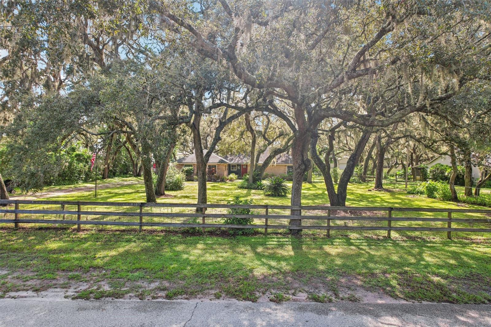 NO HOA! NO CDD! Sitting on .85 acres, this is your chance to bring ALL your toys and settle into your dream property, complete with a great neighborhood feel and zoning for top-rated local schools. The canopy of mature oaks gives this home a warm, inviting touch while offering privacy and shade in your quiet surroundings.
Inside, you’ll find a well appointed 3-bedroom, 2-bath layout with a flexible space that’s perfect for a home office, plus a bonus room for whatever you need...maybe a playroom, craft space, school room, or extra storage.
The backyard is FULL of possibilities! You’ve got a chicken coop ready to go, two storage sheds, an attached side screened porch, a detached screened porch, a rear porch, and a huge workshop with RV hookup.
Major peace-of-mind include a 2015 roof, AC, and hot water heater, so you can move right in and start enjoying country living with all the conveniences close by!