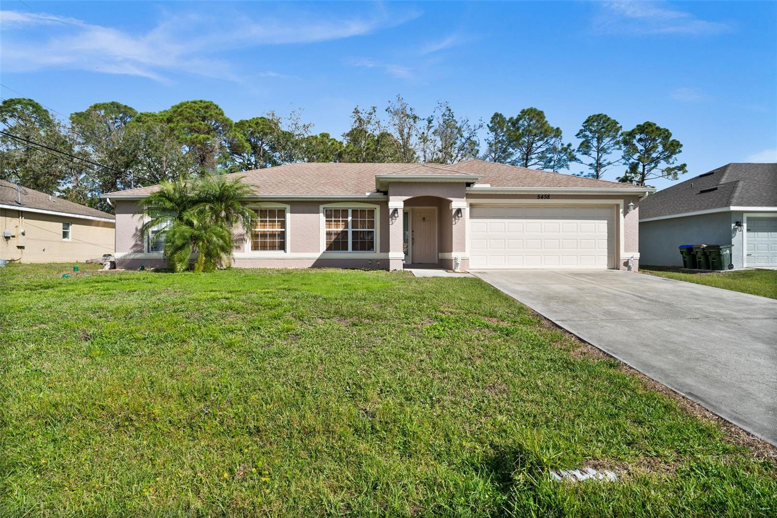 This 3-bedroom, 2-bath home with a 2-car garage offers nearly 1,600 square feet of comfortable living space. The desirable split floor plan provides privacy, while the spacious master suite features a walk-in closet, dual sinks, a garden tub and a separate shower. The kitchen is equipped with stainless steel appliances, wood cabinets and solid surface countertops. The home also features an inside utility room for added convenience. Enjoy the tile and laminate flooring and a large screened lanai perfect for relaxation. The home includes a washer and dryer and the oven and dishwasher are only two years old. A 2019 water filtration system adds to the home’s value. Furniture is optional for purchase. Additionally, with a full-price offer, the seller is offering a complete roof replacement. Finally, this home is located minutes to Warm Mineral Springs, near the future Sarasota Memorial Hospital, major highways, shopping, dining and just 25 minutes to Gulf’s beaches. NOT in a hazardous flood zone. Don’t wait—schedule your showing today!
