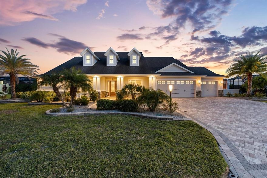 Welcome to a residence where luxury meets lifestyle—nearly 5,000 square feet of exceptional living space crafted for comfort, sophistication, and unforgettable Florida living. This stunning 3-bedroom + den, 3-bath estate sits peacefully along a protected nature preserve, providing the rare combination of total privacy and daily encounters with Florida’s most captivating wildlife. From the moment you walk in, the attention to detail is unmistakable. Diagonal tile flooring throughout, crown molding in every room, and granite surfaces reflect the quality and elegance invested into this remarkable home. The expansive living room opens seamlessly into a gourmet kitchen designed for the true culinary enthusiast. Center stage is a commercial-grade 6-burner gas cooking appliance crowned by a stainless-steel hood and framed by a stunning white brick-style backsplash that rises dramatically to the ceiling. Thoughtful lighting above and below cabinetry creates ambiance, while the oversized island with farmhouse sink and built-in microwave invites gatherings of every kind. Just off the living room is a wet bar with its own sink, ensuring refreshments are always close at hand. One of the most extraordinary features of the home is its glass-enclosed, under-air lanai, adding over 1,000 square feet to the living area. Featuring its own built-in bar with refrigerator, ice maker, and ample storage, this space brings the outdoors in — offering stunning daily views of the expansive preserve where birds and wildlife roam freely. It’s the ideal setting for celebrations with friends or peaceful mornings with a cup of coffee, as nature becomes a breathtaking backdrop to your everyday life. Step through to your private outdoor oasis — a solar-heated, gas-boostered saltwater pool and spa designed to rival high-end resorts. Enjoy the unique swim-up bar with built-in table and seating, perfect for sipping a drink while still in the water. A sun-shelf lounging area lets you relax in just a few inches of water, shaded by an umbrella while keeping cool from the Florida sun. Adjacent is a pergola-covered bar and full summer kitchen, making this space a dream come true for hosts who love entertaining outdoors. The home’s thoughtful layout continues in the private living spaces. A barn door entrance adds charm and privacy to the guest wing, where a beautifully upgraded steam shower enhances relaxation and comfort. The primary suite is truly grand in scale, offering dual walk-in closets, room for a full seating area, and a spa-style ensuite bath complete with a stand-alone soaking tub and an impressive walk-through shower with dual entries — a refined retreat designed for serenity. The 3-car garage with epoxy flooring allows ample storage. Outdoors, meticulously curated landscaping enhances the home’s curb appeal and sets a new standard for beauty in the community. Situated in the heart of The Villages®, this home offers more than luxury — it delivers an extraordinary way of life. Here, championship golf courses, sparkling pools, endless recreation centers, boutique shopping and nightly live entertainment are all part of the everyday experience — effortlessly accessed by golf cart. Whether you’re seeking tranquility, excitement, or a perfect blend of both, this community offers a lifestyle unlike anywhere else. This premier home is a statement of elegance, a rare sanctuary to experience the pinnacle of comfort, sophistication, and The Villages® lifestyle.