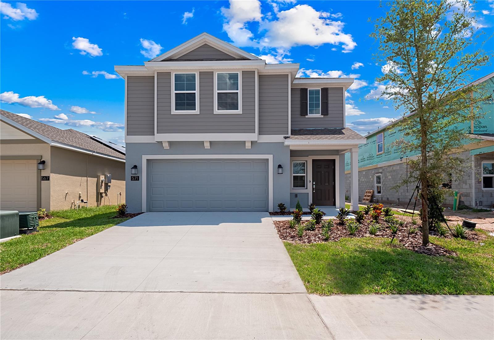 AVAILABLE SEPTEMBER 2025 and comes with SOLAR!! This beautiful 4 bedroom 2.5 bathroom home boasts almost 1900 sq ft of living space with a 2 car garage. This home is located in the Horse Creek community just a short distance from the city of Davenport and Ernie Caldwell blvd. As you enter you will love the modern grey tiles which are throughout the downstairs of this home and in all bathrooms. The open floor plan is bright and spacious. The kitchen is beautiful with white cabinets, grey quartz counter tops and stainless steel appliances. There is also a large walk in pantry. There are glass sliding doors which lead you to the spacious back yard. Downstairs there is also a half bathroom. Upstairs you have the 4 bedrooms and remaining 2 bathrooms. As you get to the top of the stairs there is a loft area which can be used as a flex space or home office. The master bedroom is a good size with ensuite bathroom. The bathroom has his and her sinks, quarts counter tops, a walk in shower with a glass stall and a large walk in closet. The laundry room with washer and dryer is also located on the 2nd floor. The final bathroom has has a tub with overhead shower. This property also comes with solar which will give you a reduced energy bill. Included in the rent is monthly lawn care. There is a community swimming pool just a short distance from the home.