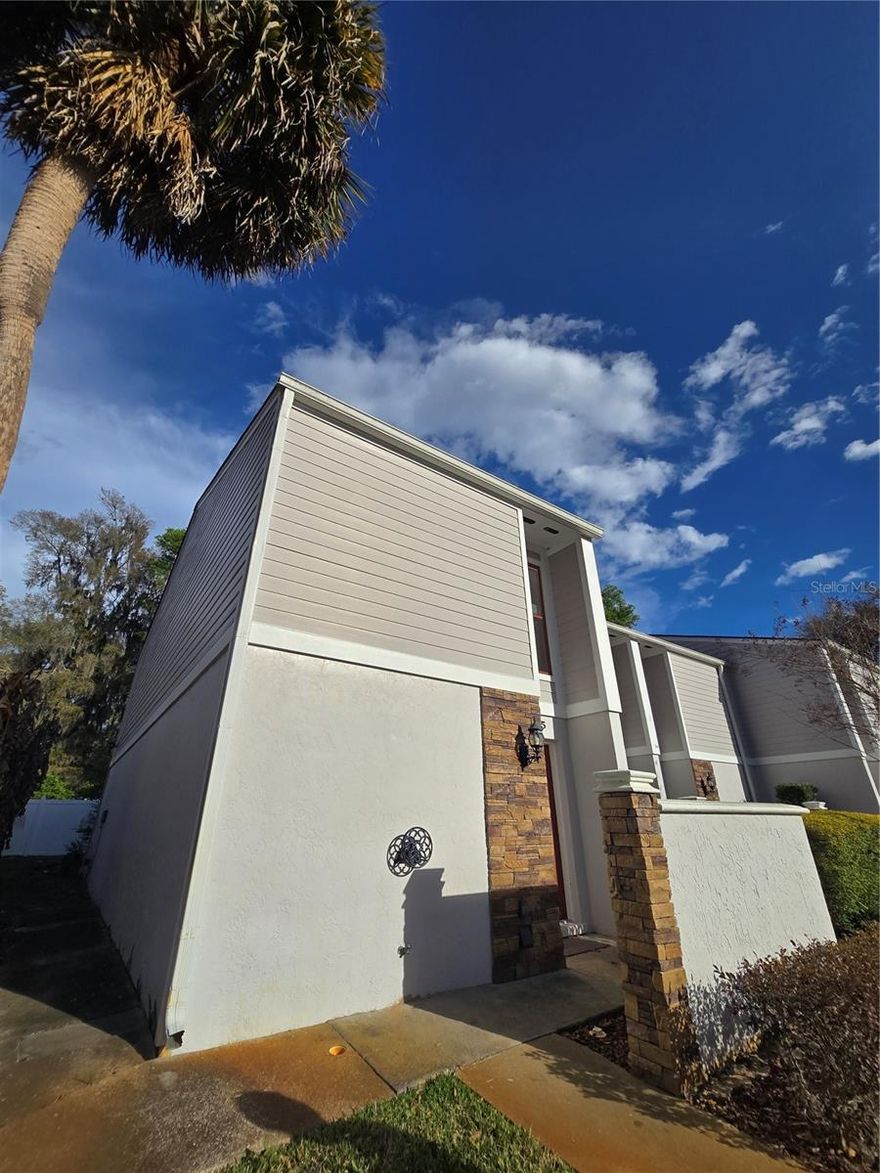 CORNER BEAUTY! Spacious 2-bedroom, 1.5-bath townhome located in the desirable Silver Pines community. This well-maintained home features both bedrooms upstairs with new carpet installed in 2023, while the main floor offers carpet & ceramic tile throughout and a spacious living area over 1200 sq ft with great flow. The updated kitchen (2023) includes new stainless-steel appliances, granite countertops, and modern cabinets with ample storage. Major upgrades include all exterior doors and windows replaced in 2022 with a lifetime warranty through Window World, a new AC unit installed in 2019, and a new roof in 2017. Enjoy the convenience of indoor laundry on the main floor and relax through the sliding glass doors onto the screened porch downstairs & balcony overlooking a fenced area. Located close to shopping, restaurants, and everyday conveniences. The HOA covers exterior pest control, insurance, grounds maintenance/ irrigation, making ownership simple. Leasing is allowed, offering flexibility for homeowners or investors. The property includes one designated parking space with additional parking available. Washer and dryer do not convey.