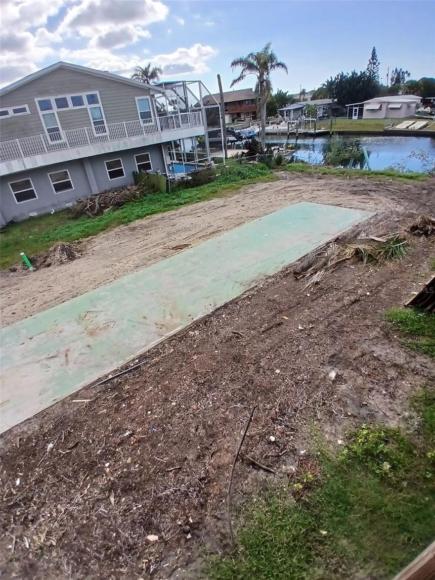 Waterfront in Hudson! This lot is CLEARED AND READY to be added to the home next door (NEW, ELEVATED BEAUTY) to add to your waterfront property. It is also an incredible opportunity to be on a GORGEOUS CANAL WITH GULF OF AMERICA ACCESS JUST A FEW MINUTES AWAY! Signal Cove is an excellent community with nearby restaurants, marina, shopping and more. THERE WAS A HOME HERE PREVIOUSLY SO NO IMPACT FEES IF YOU BUILD YOUR WATERFRONT HOME! PUBLIC WATER AND SEWER.