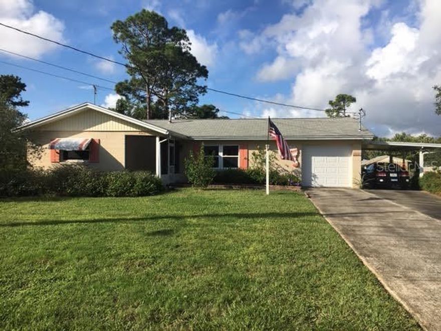 FIRST TIME ON THE MARKET!!  Charming home is a must to see and home is well cared for in the heart of New Smyrna Beach.  This home has 3 bedrooms, full bath and a half bath; home offers many updates.  Front entrance has pavers that lead to a covered cozy screened in entrance. Spacious living room, with eat-in kitchen and pantry.  Very nice long galley kitchen with white cabinets remodeled in 2013 and all new windows throughout the home 2014.  All screens are 20 mesh.  Glass sliding doors open to a large covered patio and back yard grilling.  Back yard has a utility shed and the deep yard provides room for a boat, RV parking and all your other needs. Lush landscaping for privacy. One car garage and covered carport.  Well for irrigation.
Public boat ramp is very close, (3) golf courses within 10 minutes, sports complex and park just minutes away.  Close to restaurants, shopping and the wonderful beach.  No HOA!!
Seller is giving a credit of $1,500.00 towards flooring to buyer at closing. ;Water: City
