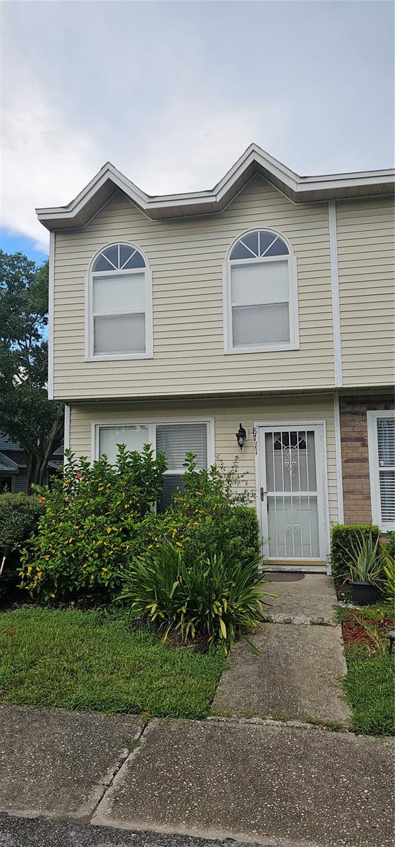 Short Sale. Large End Unit Townhome Centrally located in Tampa. Two bedroom, two & half bath with loft that can be made into a third bedroom. The main level features a spacious living area with a fireplace, perfect for relaxing. The kitchen includes plenty of cabinet space with a comfortable dining area right off the kitchen and a convenient half bath completes the main floor. The renovation/updating process was begun but not completed - Flooring has been removed from stairs and entire 2nd floor with vinyl flooring included but mostly still in boxes, new doors installed throughout the 2nd floor with new hardware and doorknobs still in boxes. Established community with assigned parking and convenient access to Suncoast/Veterans Expressway, major roads, public transportation, grocery, shopping, popular dining, airport, and beaches. This townhome is ready for buyers who want to finish the remodel with their own style.