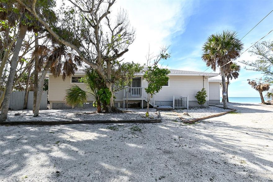 Seize the opportunity to own a piece of paradise! This is one of the last affordable pieces of paradise available with a new seawall (2021) in place and the opportunity for a private dock on Lemon Bay! Come see this easy, breezy lifestyle 1/2 mile north of Blind Pass Public Beach.   Here you will enjoy 95' of beach front privacy! Enjoy snorkeling, seashell hunting, impressive sunsets and pelican dives! Plenty of room to build new or enjoy this step back in time! A spacious, split floorplan and a 1-car garage with amazing views from morning till night! This property can also be used as an investment property with very lucrative seasonal income potential. There is also a deeded bay access on the east side of Manasota Key Road, where you can build your own private dock, then cruise through wonderful Lemon Bay to the crystal blue waters of Stump Pass Beach State Park. Manasota Key is an 11mile island just south of Venice.  Manasota Key has an optional Beach Club, which offers members a year round heated pool, tennis and pickleball courts, club kayaks, paddleboards, and shuffleboard. There are cottages your guests can use and appreciate the old Florida charm!  Manasota Key offers dining options at the south end of the Key as well as water sport rentals and fishing charters. Easy To Show!