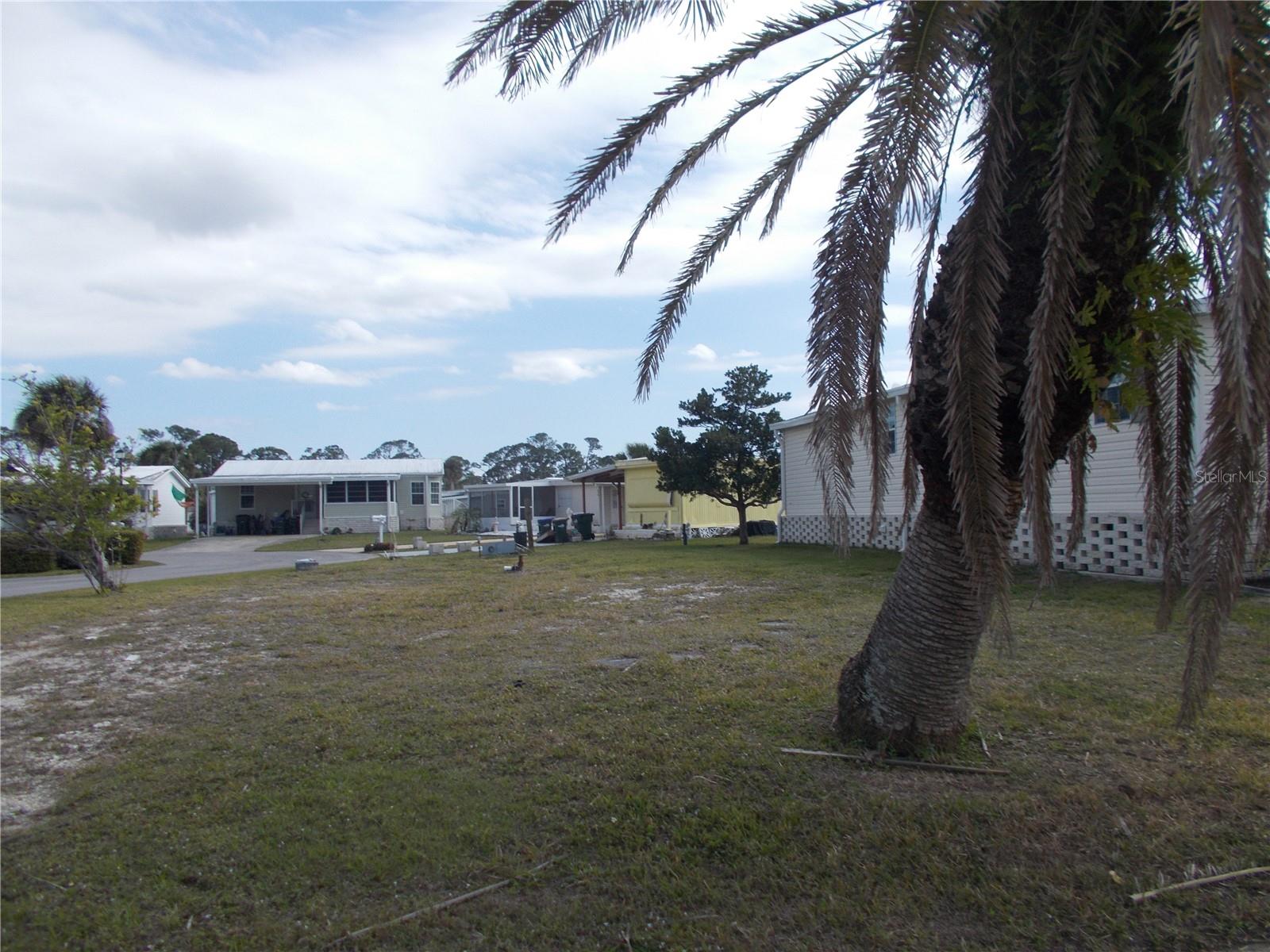 Vacant land in sought after Gated Community of Holiday Park, not in the pet section. In Holiday Park you own the land with a deed and the maintenance fee of $195.00 monthly ($2340.00 a year) is included in your taxes. This is a corner lot measuring 3623 sq ft. Holiday Park offers many amenities including 2 Pools, Tennis Courts, Pickle Ball, Bocci, Shuffleboard, Laundry, Library, Tennis, Horseshoes, Bingo plus other card games, Fitness Room and so much more. This is a perfect place for your new manufactured home. Come and see!