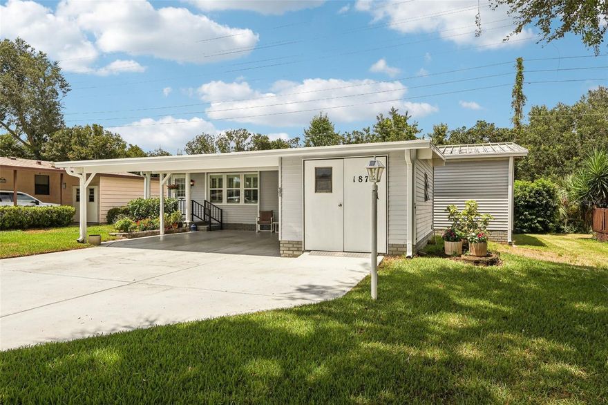 NO BOND and Golf Cart Included! This 2BR/2BA home is full of charm and ready for you to enjoy. Step inside to an open, airy layout with vaulted ceilings, updated windows, and plenty of natural light. Tile and laminate floors run throughout, accented by plantation shutters. The kitchen stands out with stylish cabinetry, a Tiffany light fixture, stainless steel appliances, and a breakfast bar perfect for casual dining.
  Laundry is conveniently located inside, and the Florida Room—under heat and air—expands your living space with glass windows that open to a private deck. With no rear neighbors, it’s an ideal setting for morning coffee, evening conversations, or simply relaxing in peace.
The primary suite offers two closets and a tiled step-in shower. A double carport, golf cart garage with workshop, and a 2014 Gas Yamaha golf cart add even more value to this home.