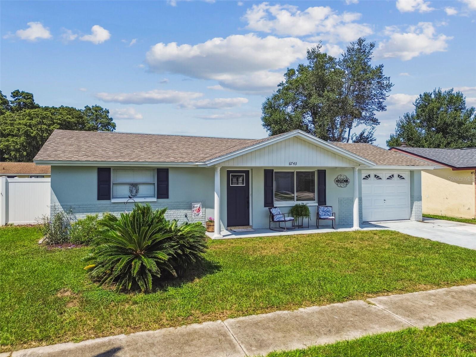 Don’t miss the opportunity to own this well-kept and fully remodeled property that you can call home. Great for a family, first home or as an investment. Spacious layout, with luxury vinyl flooring, updated kitchen and bathrooms with wood cabinets and quartzite counters. Ample living room. Master bathroom with dual shower; traditional shower and rain shower head. Well-lit 3rd room with French doors that could be used as a office/den, gym or just for relaxation room. A screen lanai to enjoy with family and friends over for gathering. Great sized backyard fully fenced with vinyl fence for privacy and enjoyment. This house is moving ready. No HOA, Flood Zone X, No CDD