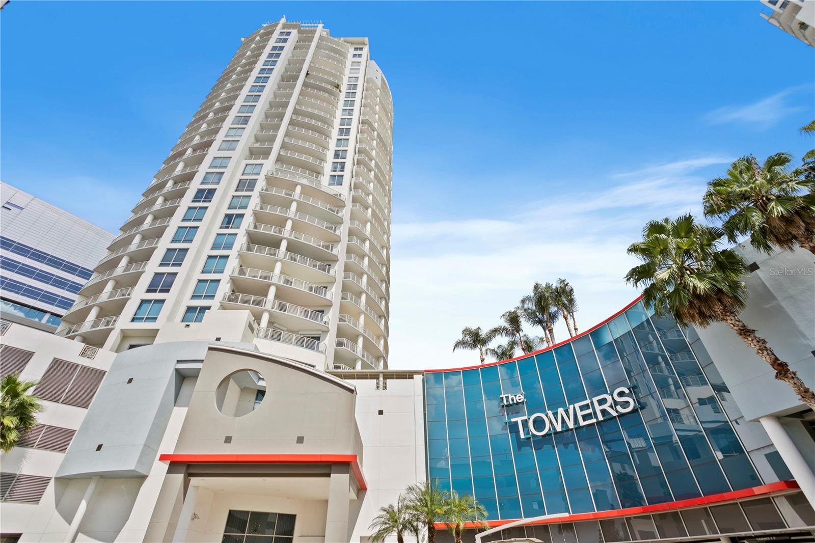 Welcome to 449 S 12th St, Unit 2702, Tampa—your penthouse in the sky. Nestled on the 27th floor of the prestigious Towers of Channelside, this exquisite residence offers a luxurious blend of comfort and style. Spanning 2,995 sqft, this expansive 3-bedroom, 3-bathroom, with two private balconies with nearly 500 sqft of private outdoor space. This home invites you to experience unparalleled living with breathtaking views, high-end finishes, and an ambiance of sophistication. Whether entertaining guests or seeking a private retreat, this penthouse delivers an elevated lifestyle in one of Tampa's most exclusive addresses. Upon entering, you’re greeted by an immersive whole-home audio system, seamlessly integrated into every room for an unparalleled auditory experience. The ceilings have been raised to their maximum height, creating a spacious and airy atmosphere that feels both expansive and intimate. In the versatile, large, bedrooms, Missoni wool carpeting provides comfort and understated luxury with each having en-suite bathrooms. The primary bedroom has more than enough room for a sitting area while also encompassing close to floor to ceiling windows to allow yourself to take in the water views. The primary bathroom is a true masterpiece. It features custom Ann Sacks tile on both the floors and walls, a unique Catchpool and Rye tub, and a stunning smoked mirror feature wall, all contributing to an open, airy, and undeniably sophisticated vibe. The secondary bathrooms have been reimagined with custom Walker Zanger tile, bringing a refined aesthetic to these spaces. Custom millwork in a sophisticated smoke color with bronze inlay adds depth and character throughout the home. The kitchen and entertaining areas are equipped with top-of-the-line Dacor appliances and rare Blanco Carrera countertops, with a full splash on the feature wall, exuding elegance and functionality. The living room is a work of art, featuring a stunning wall clad in hand-carved Nero Marquina marble with inlaid bronze details. The dining room offers a luxurious experience with its custom Phillip Jeffries horsehair feature wall, accented by a gold leaf abstract ombre detail. The column in the main living area adds warmth and texture with vintage, custom-colored terracotta bricks, a nod to timeless craftsmanship. The entire home is unified by custom French oak DuChateau wood flooring, with dynamic light coves that accentuate the sleek architectural lines, creating a play of light and shadow that enhances the home’s modern aesthetic. This penthouse is not just a living space, but an experience—luxurious, intimate, and truly unique. Every detail has been thoughtfully designed to showcase the true value and artistry of this exceptional home. This home allows for an exclusive lifestyle, complemented by top-tier amenities. Enjoy the resort-style pool with a spa and waterfall, perfect for relaxing or entertaining. This incredible property also includes 2 designated parking spaces as well as a separate storage room. Benefit from 24-hour concierge service and on-site property management, ensuring that your every need is met with the highest level of care. A designated parking garage provides convenience and security for residents. Situated in the heart of Tampa, this residence is just moments away from premier attractions like Amalie Arena, the Tampa Bay Riverwalk, and Sparkman Wharf, placing the best of the city at your doorstep.