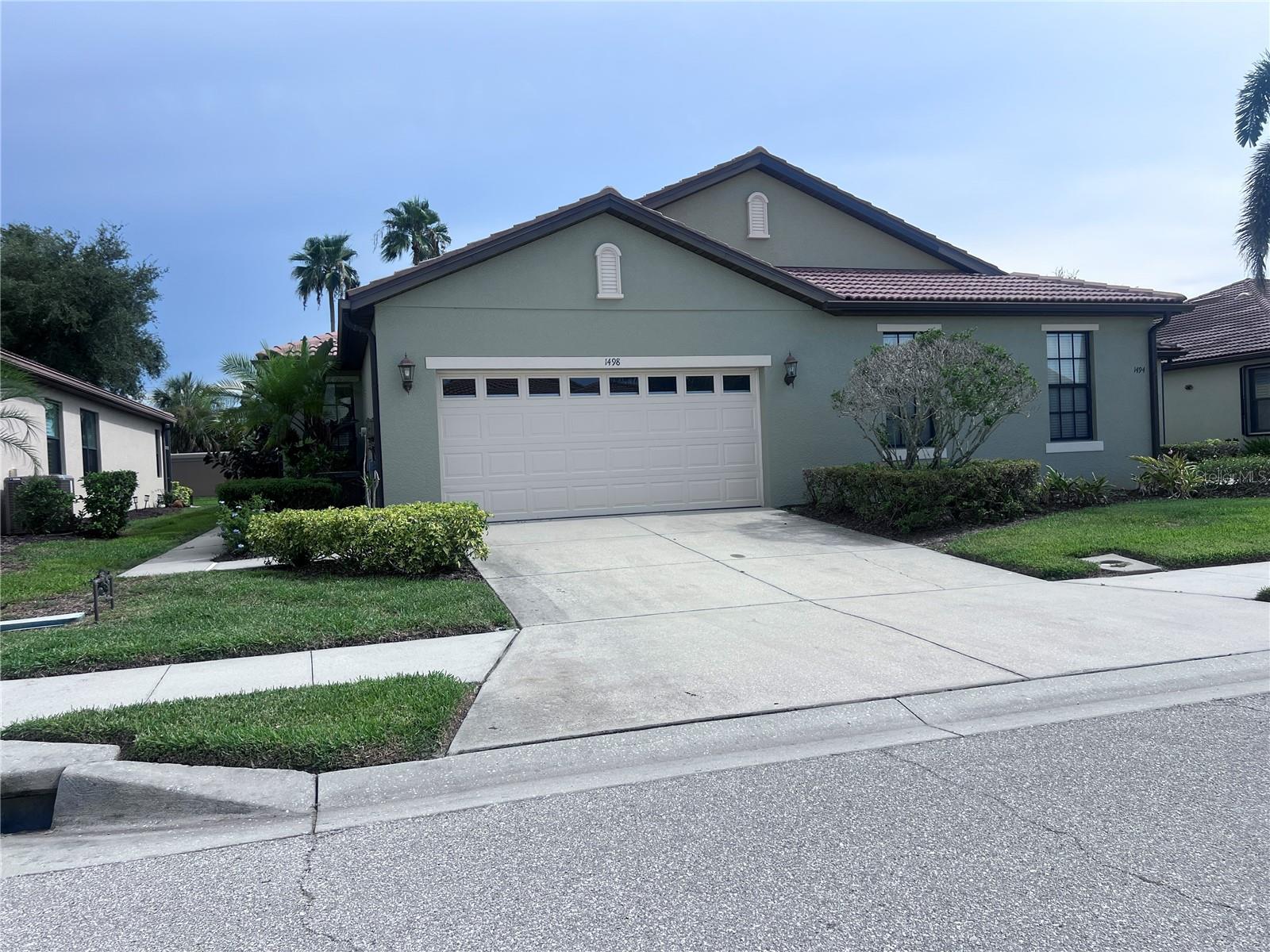 Wow! Venetian Falls! What an in demand over 55 community this is! All the activities and amenities you could imagine in this well maintained gated community! This paired villa, zero lot line home features are a large primary suite with spacious bathroom and a HUGE walk-in closet! second bath has great lighting. Den is great for an office, quiet getaway or extra sleeping area. Large laundry room has beautiful wood cabinetry and built in laundry sink. Nice garage. BRAND NEW AIR CONDITIONER! Thinking a great place to live in Venice year-round or as a winter home, then look no more! Venetian falls has a sprawling clubhouse and entertainment area that features heated lap pool and spa, unique resistance walking pool, exercise and fitness area, billiard room and more! A full time activities director and on site management office make for ease of a fun lifestyle! Irrigation, lawn care, roof pressure washing, exterior paint, cable tv and internet are all included in the modest monthly fee. NO CDD Lots of close by shopping, restaurants and the beach!! enjoy Historic downtown Venice and the New Downtown Wellen Park and the Cool Today Baseball stadium within minutes!
