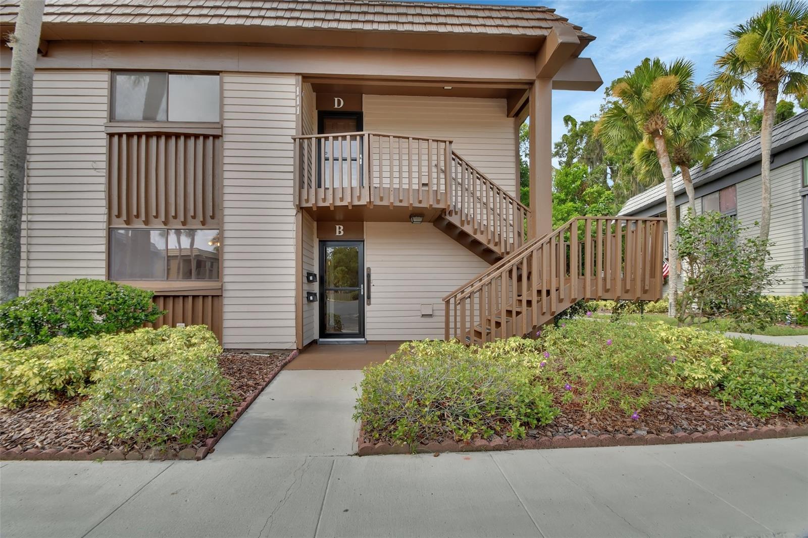 Discover your next home in the sought-after DeLand "Four Seasons" condo, a 55+ community! This Very well maintained complex is convenient to shopping, medical facilities and award winning Downtown DeLand. Perfectly positioned in the complex, this charming end unit FIRST FLOOR condo is also just a few steps away from the sparkling community swimming pool, where you can relax, unwind or enjoy the fresh air and sunshine.
Step inside this very well maintained 2-bedroom, 2-bathroom end unit home, featuring a recently updated bathroom, mobility -friendly shower is equipped with anti-slip features for your safety and comfort.
French doors off the living area lead you out to to a charming windowed porch/Florida room a perfect spot to enjoy your morning coffee or just relax with a book. Ready to move in and start enjoying!