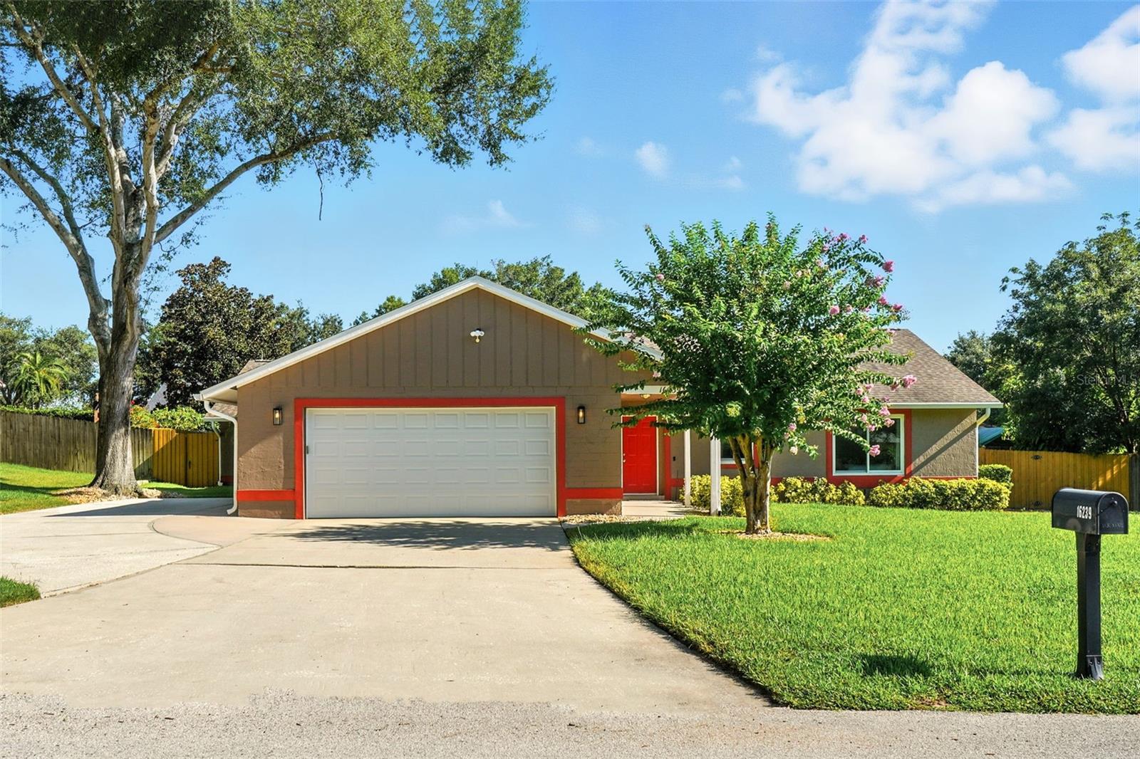 Welcome to 16239 Hillside Circle in Montverde, a beautifully updated property offering the perfect blend of modern upgrades, thoughtful improvements, and dual-living flexibility with a main home and private apartment on the same floor. Situated on a private, fenced lot with mature landscaping and a full irrigation system, this multi-family gem spans 2,756 square feet and is move-in ready with all major systems already updated. The home features luxury vinyl plank flooring installed in 2021, a 2017 roof with transferrable warranty through 2037, double-hung windows added in 2022, and new sliding glass doors and gutters in 2019. Both the main house and apartment have their own air conditioning systems (2015 and 2017) with warranty coverage through 2027, complemented by a mini-split A/C in the fully finished garage which also boasts epoxy flooring and an upgraded insulated garage door installed in 2017. Additional enhancements include two hot water heaters (2017), a whole-house water softener and dual Culligan reverse osmosis systems, lightning rods (2018), a privacy fence (2017), an 8x12 shed (2018), and a new exterior door for the apartment in 2022. The property is uniquely equipped with two septic systems, both pumped in 2021, ensuring convenience and peace of mind for multi-generational living or rental potential. Appliances convey with the sale, including a GE washer (2022), Speed Queen dryer (2016), Whirlpool dishwasher (2019), Samsung refrigerator and stove/oven (2019) in the main house, KitchenAid refrigerator and GE stove/oven in the apartment, along with two microwaves. With all major systems, appliances, and structural elements modernized, this home delivers worry-free living and versatile dual-family functionality. This rare Montverde opportunity is now fully upgraded and ready for its next chapter. Lake access within walking distance to Lake Florence creates a wonderful setting and close proximity to Montverde Academy adds an excellent option for education. You're home!