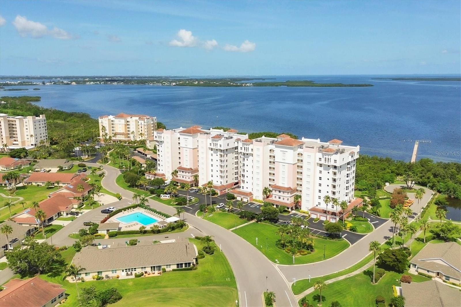 Take in spectacular sunsets and panoramic water views that allow you to watch ships sail under the Sunshine Skyway from your private 9th-floor lanai in this luxurious "Grand View" penthouse, located in the highly sought-after Terra Ceia Bay community. This spacious 3-bedroom + office/den, 2.5-bath home offers resort-style living with unmatched elegance and comfort. Step inside and be greeted by 10-foot ceilings and floor-to-ceiling impact sliders that flood the home with natural light and frame the breathtaking views. The open-concept floorplan offers an expansive living area, a formal dining room, and a cozy breakfast nook, perfect for both entertaining and everyday living. The chef’s kitchen features granite countertops, wood cabinetry, a large pantry, and stainless-steel appliances — everything you need to create memorable meals. Retreat to the luxurious primary suite, complete with two walk-in closets and a spa-inspired ensuite bath featuring a jetted tub, separate walk-in shower, and dual vanities. The split-bedroom layout offers maximum privacy for guests or family. This unit includes extra storage space on the ninth floor plus a one car garage with additional storage cabinets. Additional amenities include a beautiful and private pool area complete with bathrooms, outdoor shower, spa, gathering areas, BBQ area with additional picnic seating, and a firepit. This gated community also includes a fishing pier and ¼ mile boardwalk to take in the estuary and mangrove views. Amenities with additional fees include, an 18-hole executive golf course, pickleball, tennis, full-service restaurant and pub, additional pool with tiki bar, fitness center, and many social activities to participate in. Located near the world-renowned beaches of Anna Maria Island, and within easy reach of the arts, dining, and shopping in Bradenton, St. Pete and Sarasota, this home offers a rare blend of tranquility, convenience, and luxury.