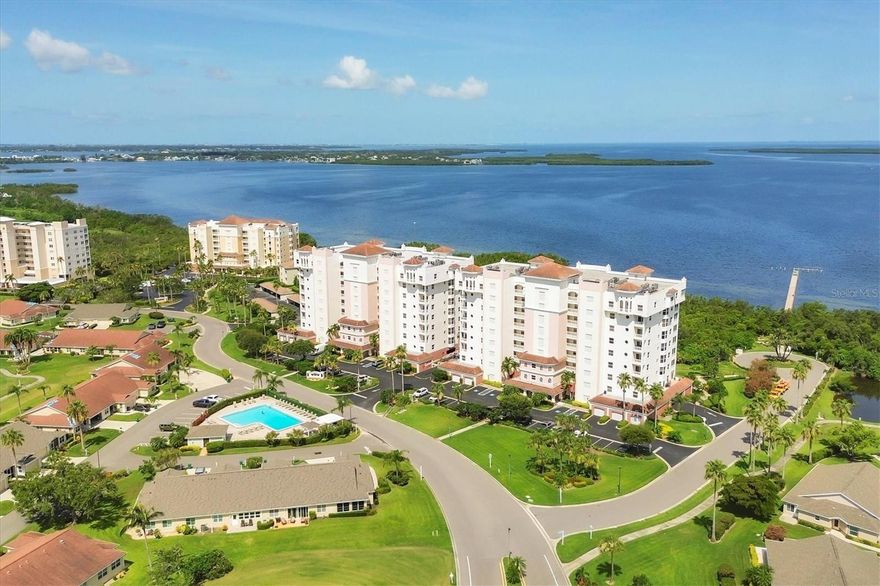 Take in spectacular sunsets and panoramic water views that allow you to watch ships sail under the Sunshine Skyway from your private 9th-floor lanai in this luxurious "Grand View" penthouse, located in the highly sought-after Terra Ceia Bay community. This spacious 3-bedroom + office/den, 2.5-bath home offers resort-style living with unmatched elegance and comfort. Step inside and be greeted by 10-foot ceilings and floor-to-ceiling impact sliders that flood the home with natural light and frame the breathtaking views. The open-concept floorplan offers an expansive living area, a formal dining room, and a cozy breakfast nook, perfect for both entertaining and everyday living. The chef’s kitchen features granite countertops, wood cabinetry, a large pantry, and stainless-steel appliances — everything you need to create memorable meals. Retreat to the luxurious primary suite, complete with two walk-in closets and a spa-inspired ensuite bath featuring a jetted tub, separate walk-in shower, and dual vanities. The split-bedroom layout offers maximum privacy for guests or family.  This unit includes extra storage space on the ninth floor plus a one car garage with additional storage cabinets. Additional amenities include a beautiful and private pool area complete with bathrooms, outdoor shower, spa, gathering areas, BBQ area with additional picnic seating, and a firepit. This gated community also includes a fishing pier and ¼ mile boardwalk to take in the estuary and mangrove views. Amenities with additional fees include, an 18-hole executive golf course, pickleball, tennis, full-service restaurant and pub, additional pool with tiki bar, fitness center, and many social activities to participate in. Located near the world-renowned beaches of Anna Maria Island, and within easy reach of the arts, dining, and shopping in Bradenton, St. Pete and Sarasota, this home offers a rare blend of tranquility, convenience, and luxury.