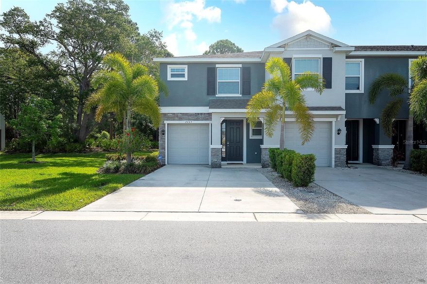 Beautiful two-story end-unit townhome located in the Bay Landing community. The open-concept first floor features a spacious kitchen with island, powder bath, and a large living area that opens to a covered screened-in patio overlooking wooded and pond views. Upstairs includes a primary suite with dual walk-in closets and an ensuite bathroom, two additional bedrooms, a full bathroom, and a convenient second-floor laundry area. The home comes equipped with refrigerator, dishwasher, electric range, microwave, and washer/dryer. Community amenities include clubhouse, fitness center, pool, playground, and dog park. Conveniently located near shopping, dining, and major roadways.