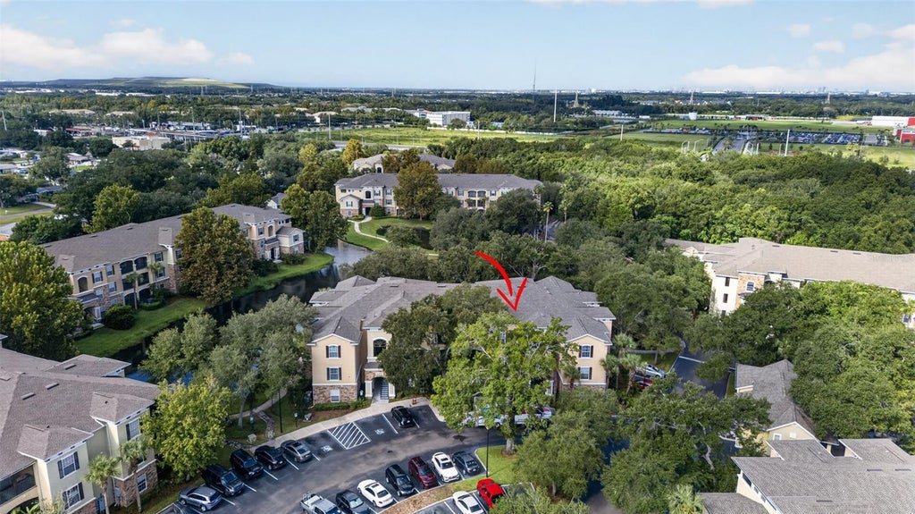 Photo of 10103 Courtney Oaks Circle #302, Tampa, FL 33619 (MLS # TB8545272)