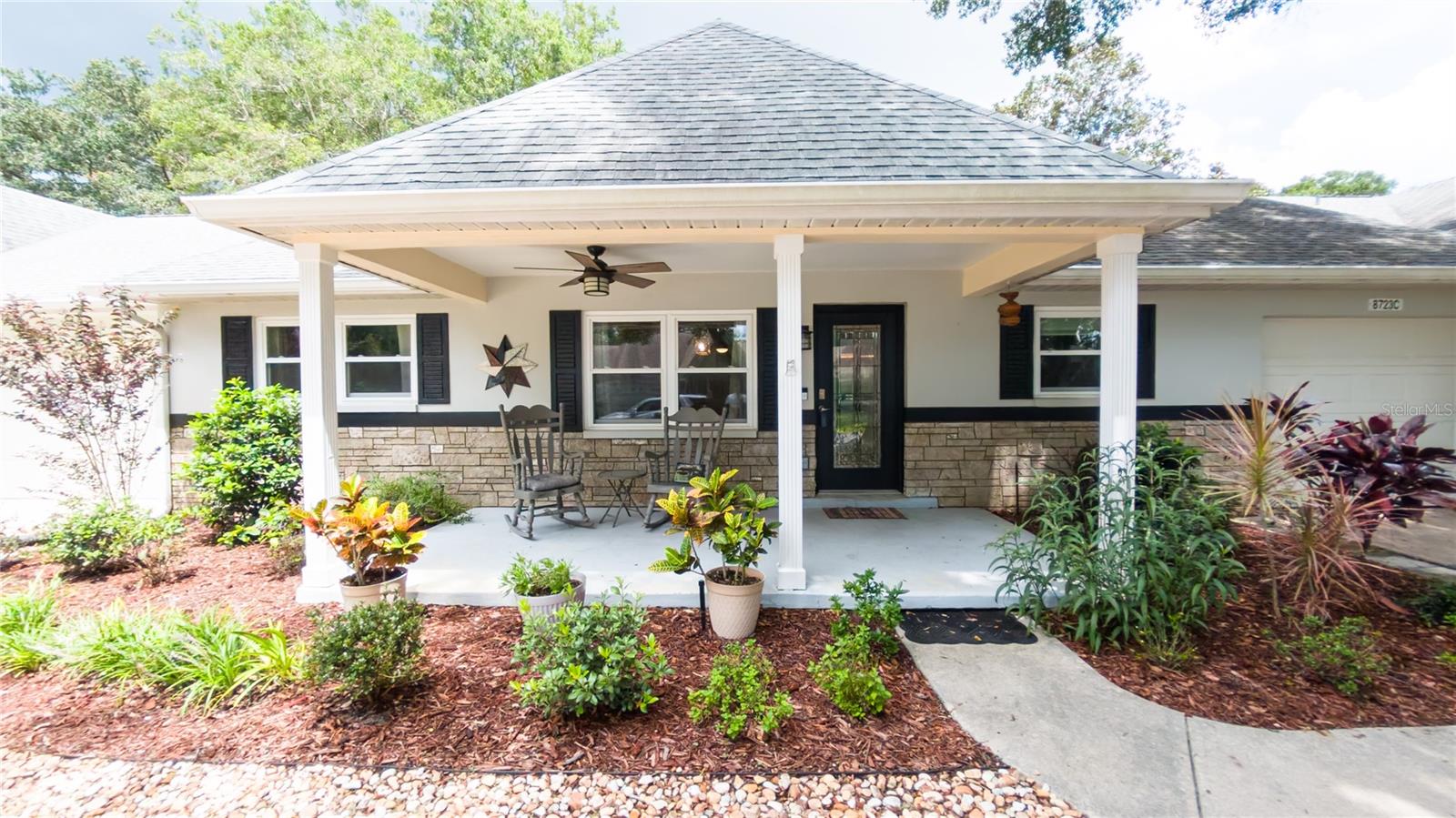Some photos have been virtually staged. Fully renovated and customized Birmingham villa featuring a stunning upgraded kitchen with premium cabinets, granite countertops, stainless steel appliances, recessed lighting, and a spacious island with extra storage. The primary suite boasts a custom walk-in closet with built-ins, a beautifully tiled walk-in shower, and quartz countertops. Enjoy the enclosed Florida room that opens to a serene private patio, perfect for relaxing or entertaining. Golf cart parking and charging station are conveniently located at the rear of the home. This home is unlike any Birmingham model you will see. Recent updates include new windows (2021) and a roof (2018), ensuring peace of mind and move-in readiness.