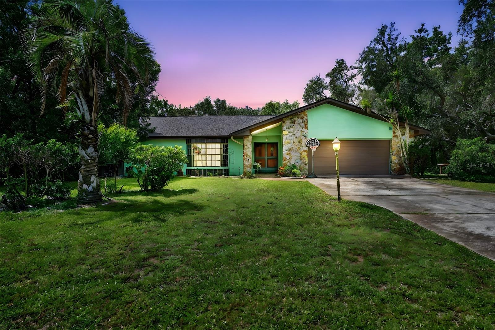Welcome to this beautifully maintained 3-bedroom, 2-bathroom pool home with a 2-car garage, perfectly situated on a FULL ACRE of land with NO HOA and NO DEED RESTRICTIONS—giving you the freedom to park your boat, RV, or simply enjoy wide open space. Offering over 2,300 square feet of living space, this home blends comfort, functionality, and plenty of room to entertain both inside and out.
Step into the inviting sunken living room, complete with a wood-burning fireplace, built-in shelving, and a wet bar—the perfect spot for gatherings with family and friends. The spacious primary suite is truly a retreat, featuring patio doors that open directly to the screened pool and lanai, a huge walk-in closet, and a luxurious ensuite bathroom with a double-sink vanity, relaxing Roman tub, and walk-in shower.
The split-bedroom layout offers privacy for all. The second bedroom includes built-in desk and shelving, a large walk-in closet, and its own set of patio doors leading to the pool area—ideal for guests or a home office. The third bedroom also features a generous walk-in closet. The second bathroom is conveniently designed with an exterior door for direct pool access, making it easy to rinse off after a swim.
The kitchen and dining areas offer plenty of cabinet and counter space for cooking and entertaining, while the inside laundry room adds convenience. Tile flooring runs throughout the home for easy maintenance. Additional upgrades include a whole-house water filtration system and a brand-new roof (2024), providing peace of mind for years to come.
Step outside to your screened-in pool and lanai, perfect for relaxing or entertaining, all while enjoying the privacy and beauty of your 1-acre property. With no community restrictions, you have endless possibilities for gardening, storing recreational vehicles, or creating your own outdoor paradise.
Don’t miss your chance to own this spacious, well-appointed home that combines indoor comfort with outdoor freedom—all just minutes from shopping, dining, and major highways. Schedule your private tour today!