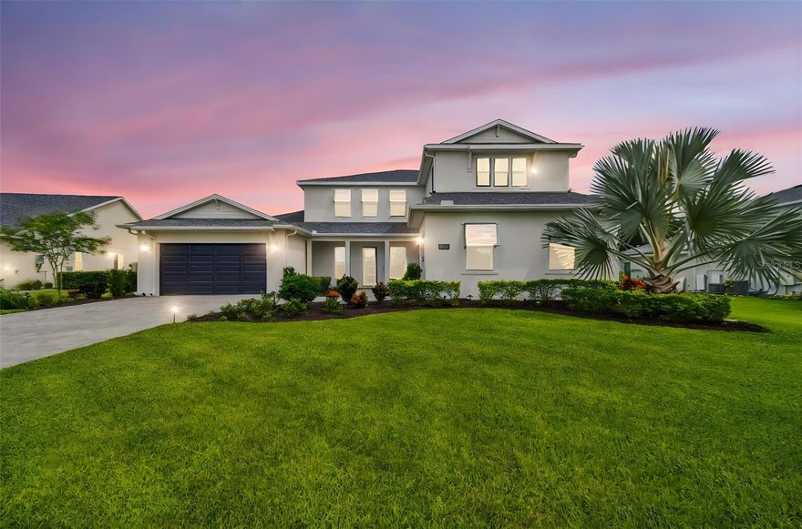 Welcome home to this like new executive home on a 1/2 acre lot in the gated community of Livingston Grove! This 2 year old home features over 4,600 square feet, 4 bedrooms, 4 full bathrooms and 1 half bathroom, an office, a bonus room, a loft and a split 3 car garage overlooking water and conservation area across the street and in the back yard. The grand two story foyer greets you upon entering, leading to an open sweeping family room / kitchen / dining room floor plan. Full list of UPGRADES available – too many to list. The current (original) owners have spent over $250K in after the fact upgrades, including over $100K in smart home automation features (in-ceiling outdoor TV, video distribution, audio distribution, smart locks, cameras, lighting and shades, and Savant system pre-wired for much more), retractable hurricane rated lanai screen, custom exterior and landscape lighting, upgraded pantry shelving system, primary closet built ins, media wall, and upgraded light fixtures (including a variety of Restoration Hardware chandeliers and sconces). The upgraded kitchen features double in wall ovens, oversized fridge/freezer, spacious pantry, upper cabinets to the ceiling, pot filler and large island with waterfall. Along the Family Room you will find a beautiful built in media wall with shelving and cabinetry, a built-in fireplace, and a hidden door that leads to the primary retreat. Your private downstairs master features a large bedroom overlooking the private backyard and an adjoining with 2 fully built out closets, dual vanities, a soaking tub, upgraded toilet and illuminated mirrors. Down the other wing, you will find a full private bedroom with en suite bathroom and a separate office. Venturing upstairs, there is plenty of space to unwind with the large open loft, enormous Bonus Room that could be a game room, movie room, or flex space, as well as split bedrooms, each with en suite bathrooms. This functional and inviting home is centrally located in Lutz on the Hillsborough County side, in a peaceful setting but just minutes to a new Publix shopping plaza, restaurants and additional amenities off SR-54, as well as high quality schools such as Lutz Prep and Carrollwood Day School. Just 15 minutes from I-275, you can have the best of both worlds and find yourself in downtown Tampa and all the excitement of the city in just 30-40 minutes.
