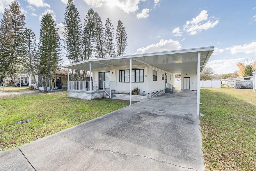 Welcome to this beautifully renovated 2-bedroom, 2-bathroom mobile home in Lakeland Florida! Fully updated within the past year, this move-in-ready home offers modern finishes, an open and spacious floor plan, and comfortable living throughout.  The bright and airy living area flows seamlessly into the kitchen and dining space, creating the perfect setting for both everyday living and entertaining. The primary suite features a stunningly updated en suite bath and a generously sized walk-in closet, providing a true private retreat. The second bedroom and full bath are ideal for guests, family, or a home office.  Sliding glass doors lead out to a covered front porch—perfect for relaxing with your morning coffee or unwinding in the evening. The property includes a 1-car covered carport with ample additional driveway space for multiple vehicles. You’ll also appreciate the extra storage with a shed located in the carport and an additional shed behind the home.  Conveniently located near shopping, dining, entertainment, and medical facilities, this home also offers easy access to State Road 92 and is just a short drive to State Road 98, making commuting a breeze.  Don’t miss your opportunity to own this beautifully updated home in a fantastic location!