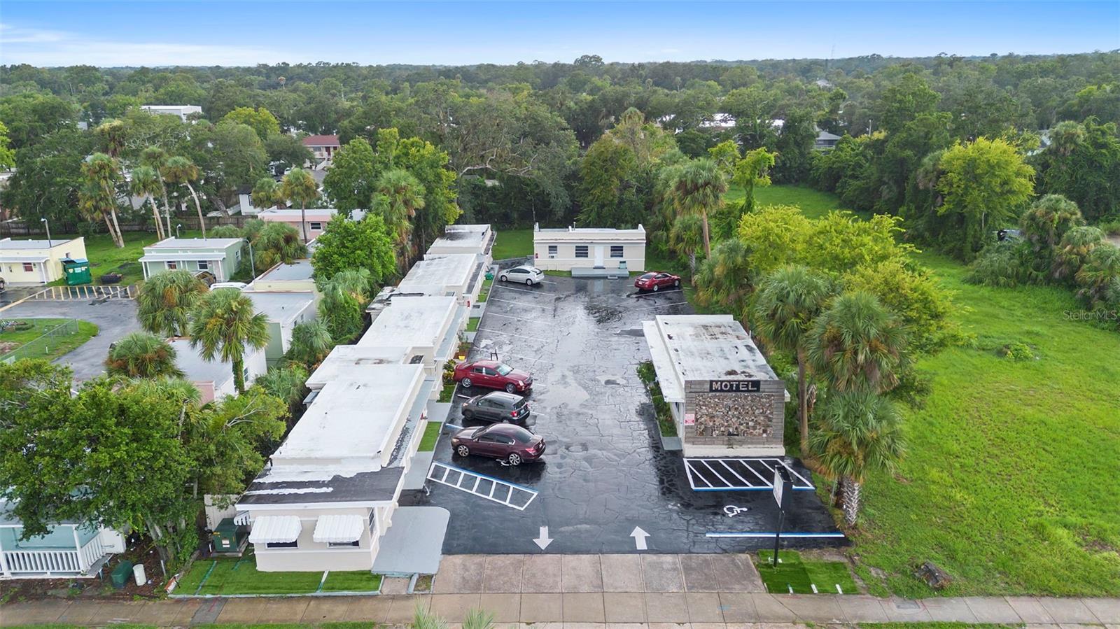 Fantastic investment opportunity on Ridgewood Avenue in Holly Hill/Daytona Beach! The In dian Palm Motel is a well-established hospitality property featuring 14 income-producing units, an on-site office, coin-operated laundry facilities for guests, and 16 dedicated parking spaces on a 0.56-acre parcel. With excellent frontage and visibility along busy US-1, this motel enjoys an impressive year-round occupancy rate, making it a strong and reliable cash-flowing asset.
Originally built in 1946, the property has operated successfully for decades and continues to benefit from steady demand from both local and tourist markets. Its convenient layout, manageable size, and built-in amenities provide an easy-to-operate business model that appeals to both seasoned hospitality operators and first-time investors seeking an accessible entry point into the motel business.
The location is a standout feature: just 5 miles from the world-famous Daytona International Speedway and less than 3 miles from the Daytona Beach shoreline, this property attracts year-round visitors, seasonal travelers, and event-driven demand. Ridgewood Avenue/US-1 is one of Volusia County’s busiest commercial corridors, ensuring high traffic counts, strong visibility, and easy access for guests.
For investors, the site offers not only a proven operating business but also future upside. The 0.56-acre lot provides potential for improvements, repositioning, or even redevelopment to maximize returns in a thriving market that continues to grow with tourism, residential, and commercial development.
Whether you are seeking a stable income-generating hospitality property or a site with long-term development potential, the In dian Palm Motel presents a unique opportunity in one of Florida’s most active coastal markets.