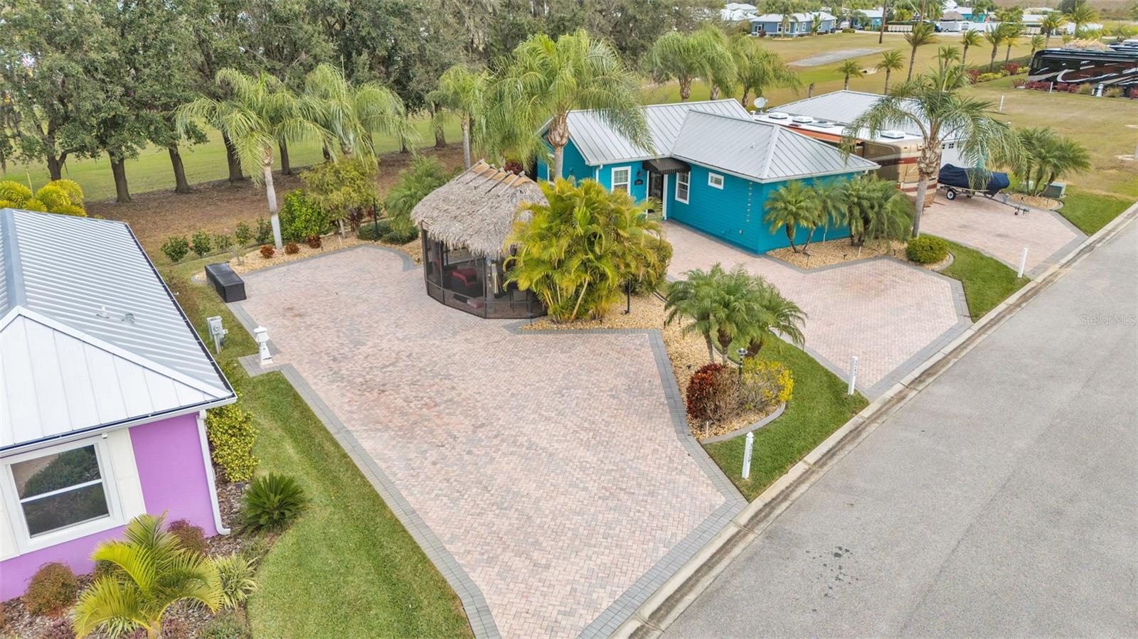 Lovely Paver Pad with a Screened Tiki Hut and lush landscaping! There is plenty of room for your motorcoach and extra vehicles!
This property can be purchased by itself or with either or both of the adjacent lots to the east.
Bay Lake Motorcoach Resort is a Class A motorcoach resort offering incredible amenities. Owners and visitors can fill their days with activities and club outings or simply relax and enjoy the resort. Whether in search of community, travel, relaxation or recreation, Bay Lake is your home base for the Florida Lifestyle.