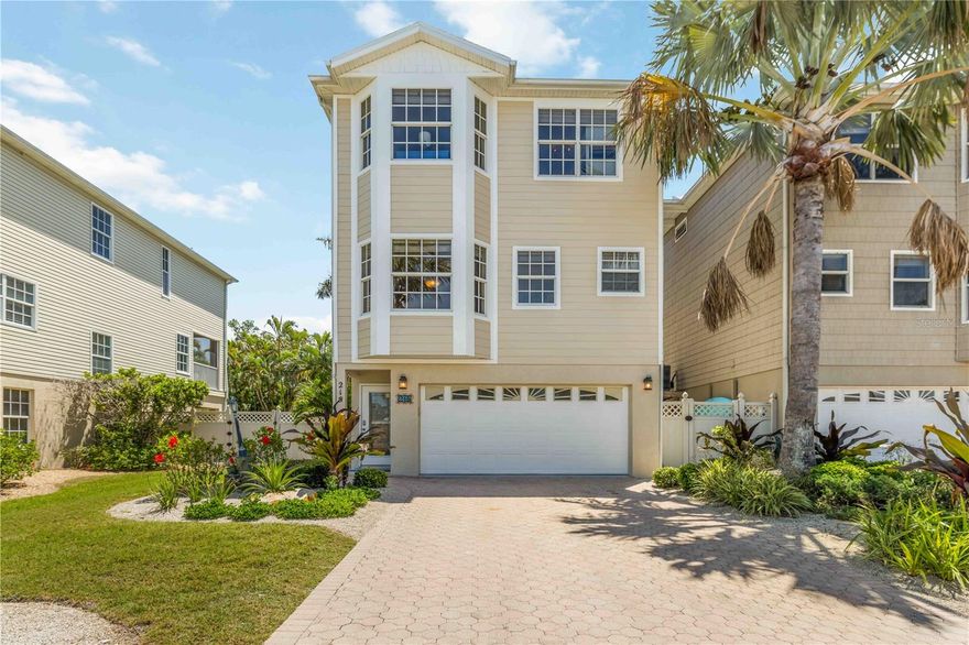 Nestled near the north end of Anna Maria Island, 215 81st Street is a three-bedroom, two and a half bath home boasting over 2,000 square feet of living space—an Airbnb gem zoned for weekly rentals. Just two blocks from some of the island’s most pristine beaches, this property offers a true tropical paradise out back. The fully fenced oasis features a gorgeous pool with a built-in hot tub, while the expansive paver-lined lounge area creates a true island escape.

 The elevated design includes a two-car garage and a game room—currently set up with a ping pong table but offering ample space to add additional attractions for guests.  The second floor invites you into a bright, open living, dining, and kitchen area with a half bath, complemented by a massive, screened-in balcony deck (freshly screened in less then a year ago) overlooking the pool oasis below—perfect for soaking in the tropical ambiance. You will also find a dedicated interior laundry room with full size washer and dryer on this floor as well. On the third floor, you’ll find three spacious bedrooms and two full baths, with the primary suite offering not only luxury but also absolutely gorgeous views from every angle—a panoramic reminder of the beauty that surrounds you on Anna Maria Island.

This home is packed with recent updates: a 2022 roof, 2019 AC, and a brand-new water heater. The exterior shines with hardie board siding installed less than a year ago and fresh paint. Beyond the home, you’re a stone’s throw from Pine Avenue’s charm and all that Anna Maria offers—laid-back vibes, local eateries, and coastal culture. Fully furnished and turnkey, this is both a thriving investment and an island escape waiting for you.