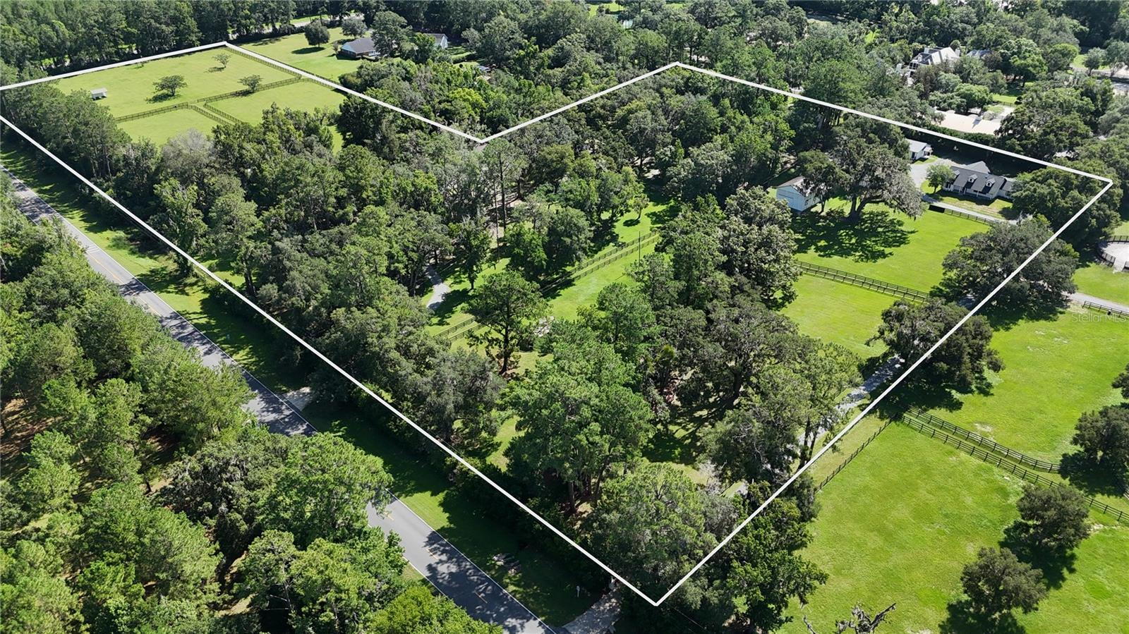 This ideally located equestrian property in central Northwest Ocala horse country spans over 16 acres and is located conveniently close to major thoroughfares, HITS, the World Equestrian Center, and additional equine venues.
The charming farmhouse features a large covered front porch that offers lovely views and seating to enjoy the views of the farm. This 3-bedroom, 2-bath home provides 2,209 +/- square feet of living space. The cathedral beam ceilings and thoughtfully designed split floor plan enhance the home’s appeal. The kitchen, open to the family room, is perfect for entertaining family and friends. With new appliances, quartz countertops, and ample cabinet space, the kitchen combines both style and functionality. Every window in the home offers stunning views of the farm, bringing the beauty of the land into the interior. The home is filled with natural light and features premium LVP flooring throughout.
The property includes level paddocks ideal for jump setups, making it suitable for various disciplines and skill levels. There are four barns with a total of 19 stalls, air-conditioned tack and feed rooms, wash racks, a laboratory with an office area, and a breeding shed.
Additional highlights include an RV hookup and a whole-house generator. With the World Equestrian Center just a few minutes away, this property is an exceptional choice for equestrians seeking tranquility and a thriving community.