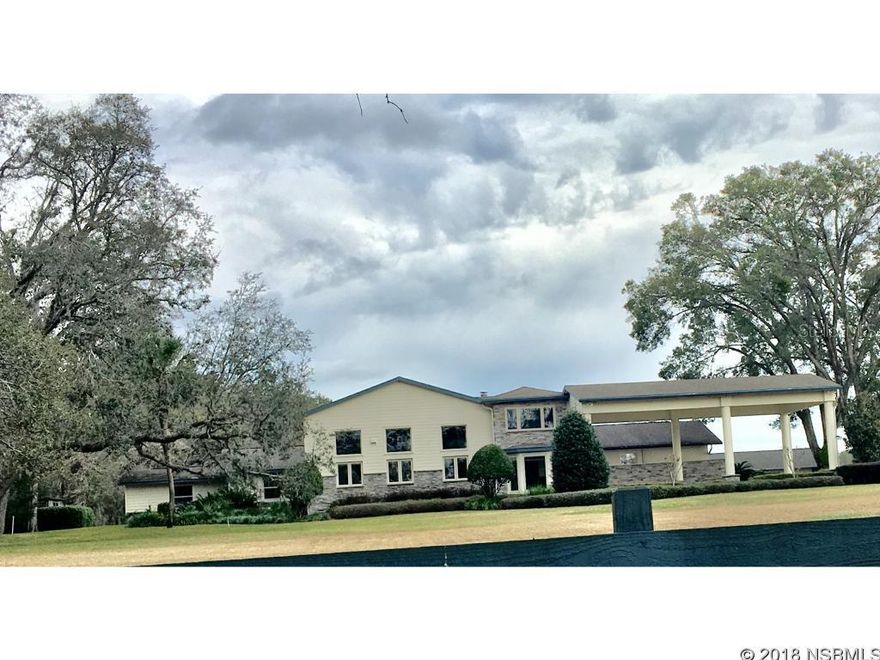 7 plus acres estate with 3 car garage, pool and guest house.