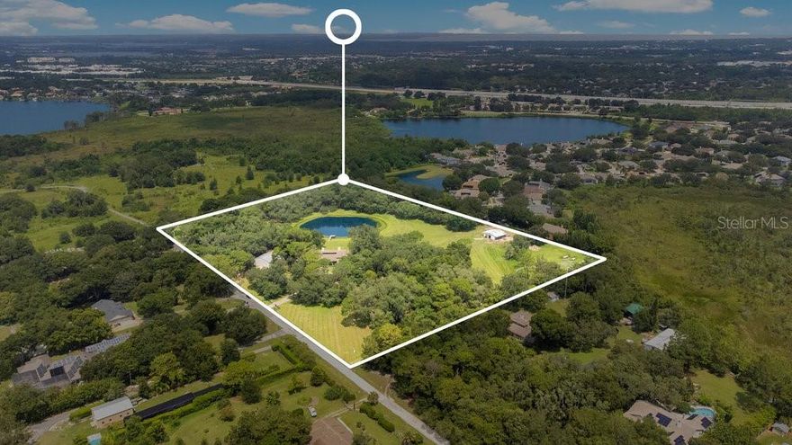 Welcome to “Home Again Ranch,” your extraordinary 12+ acre farm that is around the corner from Windermere and tucked away on a quiet cul-de-sac road. You don’t need to drive hours to experience country living at its finest. This is a once in a lifetime opportunity to own a large parcel of land zoned agricultural with NO HOA in the heart of one of Central Florida’s most desirable residential areas. The charming main residence has close to 4,000 square feet under air, and includes 5 bedrooms, 4 bathrooms, bonus room, an attached two car garage, 75’ porch overlooking your private pond with dock, and a swimming pool. There is an air-conditioned steel building for your equipment, storage, or extra living space. Horses and livestock can be housed comfortably in their own barn and graze in the corrals. Bring your vision to life whether it be farming, equestrian, or just wanting a great sense of privacy away from the hustle and bustle. The residence is zoned for Lake Whitney Elementary and Sunridge Middle School which are “A” rated schools.  Location can’t be beat. Just 20 minutes to Disney World & Universal Studios, 5 minutes to Downtown Windermere, 10 minutes to historic downtown Winter Garden, and 30 minutes to Orlando International Airport. Don’t miss out on this incredible life-changing residence!
