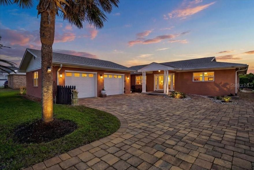 Situated on an oversized 0.30-acre lot, this solid block single-family home offers exceptional coastal living with deeded beach access and an easement to the Intracoastal. Extensively renovated in 2019, the home also features a new roof (2022).
Inside, the home showcases a beautifully designed kitchen with custom Neff cabinetry, a 6-foot island, and premium Bosch appliances, including a convection oven/microwave, oven, glass Viking cooktop, and overhead venting, complemented by a Samsung refrigerator. Living areas feature porcelain tile flooring, while all three bedrooms are finished with bamboo plank flooring. Two floor outlets in the living room to accommodate electric couches or lamps. Both bathrooms are thoughtfully updated with floor-to-ceiling tiled showers, hands-free toilet systems, and grab bars, including a spacious en-suite bath and well-appointed guest bath. The home is designed with accessibility in mind, featuring a front entry ramp and strategically placed grab bars for comfort and ease of living.
Major system upgrades include a new air handler and heat pump HVAC system 2026, a 40-gallon water heater 2026, a Puronics water softener system, and a whole-house generator with a 100-gallon propane tank. An automatic irrigation system supplied by a dedicated well adds efficiency and convenience.
Outdoor living is a standout feature, highlighted by a 2019 in-ground saltwater heated kidney-shaped pool and an expansive screened lanai of approximately 1,400 square feet, complete with lighting, electrical outlets, and a fully paved pool deck. Additional exterior features include an oversized 25x25 two-car garage and a spacious 45x30 paver driveway.