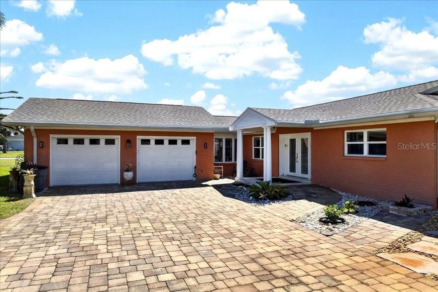 Situated on an oversized 0.30-acre lot, this solid block single-family home offers exceptional coastal living with deeded beach access and an easement to the Intracoastal. Extensively renovated in 2019, the home also features a new roof (2022).
Inside, the home showcases a beautifully designed kitchen with custom Neff cabinetry, a 6-foot island, and premium Bosch appliances, including a convection oven/microwave, oven, glass Viking cooktop, and overhead venting, complemented by a Samsung refrigerator. Living areas feature porcelain tile flooring, while all three bedrooms are finished with bamboo plank flooring. Both bathrooms are thoughtfully updated with floor-to-ceiling tiled showers, hands-free toilet systems, and grab bars, including a spacious en-suite bath and well-appointed guest bath. The home is designed with accessibility in mind, featuring a front entry ramp and strategically placed grab bars for comfort and ease of living.
Major system upgrades include a new air handler and heat pump HVAC system 2026, a 40-gallon water heater 2026, a Puronics water softener system, and a whole-house generator with a 100-gallon propane tank. An automatic irrigation system supplied by a dedicated well adds efficiency and convenience.
Outdoor living is a standout feature, highlighted by a 2019 in-ground saltwater heated kidney-shaped pool and an expansive screened lanai of approximately 1,400 square feet, complete with lighting, electrical outlets, and a fully paved pool deck. Additional exterior features include an oversized 25x25 two-car garage and a spacious 45x30 paver driveway.