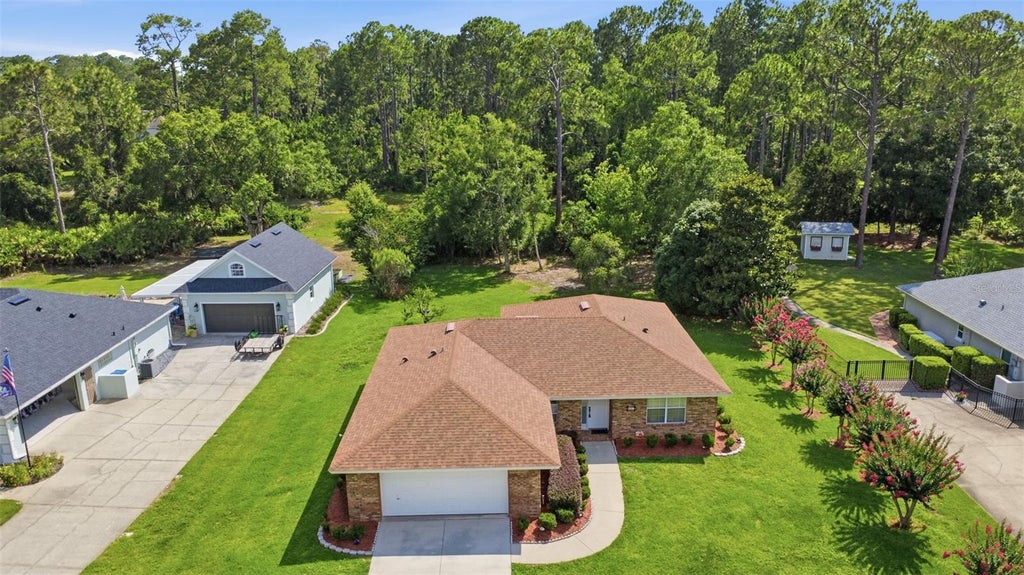 Photo of 687 Winterberry Trail, Deland, FL 32724 (MLS # V4949823)