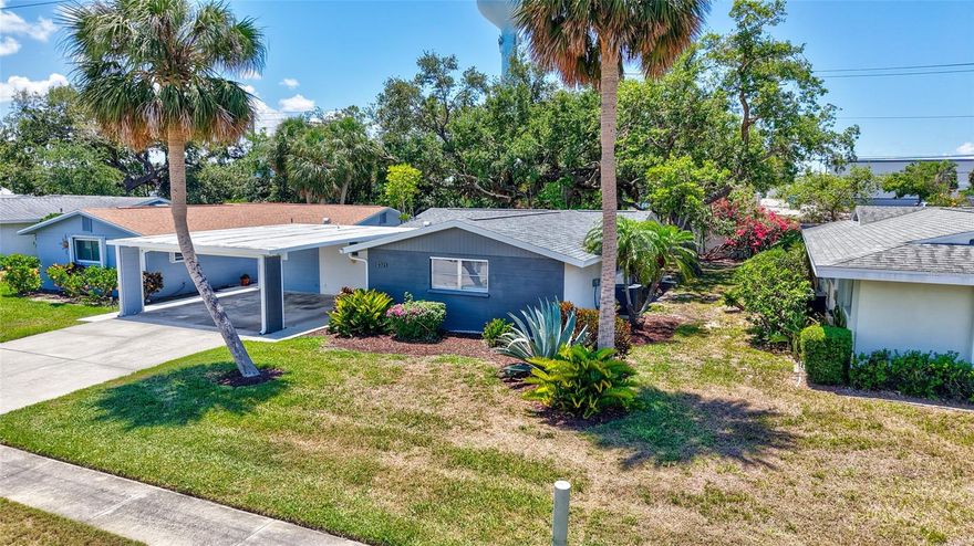 Located just north of the Gulf Gate Village, this quiet street of single family homes is one of the best-kept secrets in Sarasota!  This professionally redesigned & fully renovated 2-bedroom, 2-bathroom w/enclosed breezeway residence offers a perfect blend of classic style & contemporary living.  Step inside and be greeted by a light & bright open floor plan, where the heart of the home is a chef’s dream kitchen.  The designer kitchen features solid wood cabinetry, ample storage, newer appliances, task & undercounter lighting.  The stylish floating island provides extra storage & bar seating.  The tasteful design elongates into the dining area anchored by a large credenza & features sleek, frosted glass butterfly opening upper wall cabinets. The open space seamlessly flows into the cozy great room and the outside enclosed porch, a versatile area with glass windows & screens, perfect for relaxing & entertaining. Outside, mature maintenance-free  landscaping, including a majestic oak tree framing the backyard, creates a serene & private oasis. This freshly painted, move-in ready home has a 2022 Roof, 2020 HVAC with 2022 UV lights and new ductwork, & a 2020 Hot Water Heater. The low monthly Homeowners Association fee of $135 includes maintenance-free landscaping & internet service! A detached utility building with laundry provides added convenience, and a carport provides protected parking.  Perhaps the best feature of all is the location – just steps away, yet peacefully tucked away from the vibrant GULF GATE VILLAGE. If you are looking for a place that feels like home, a place where community connections are valued & the excitement of walking to explore Gulf Gate’s local shops, services & restaurants – you have arrived! Don’t delay on scheduling your private showing before this golden opportunity is gone!